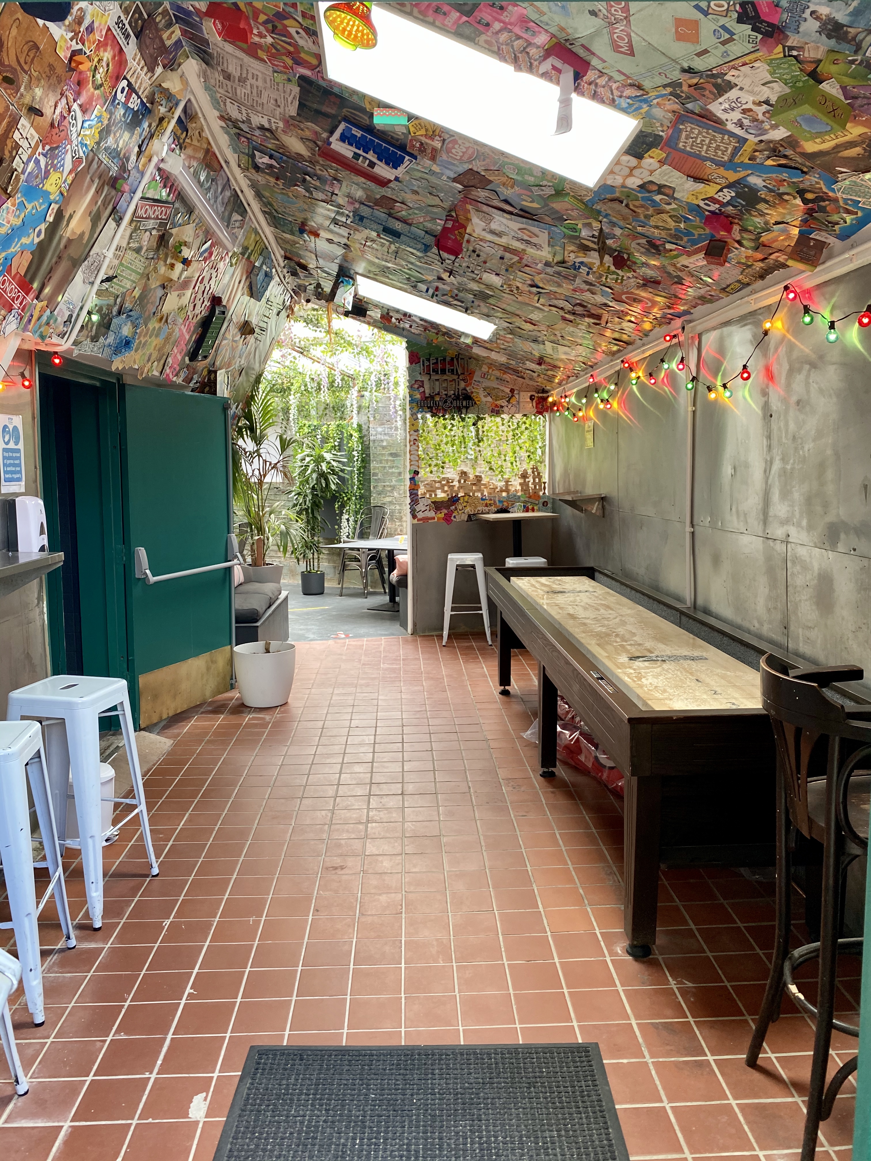 Vibrant event space in Draughts Hackney with shuffleboard for networking and team-building.