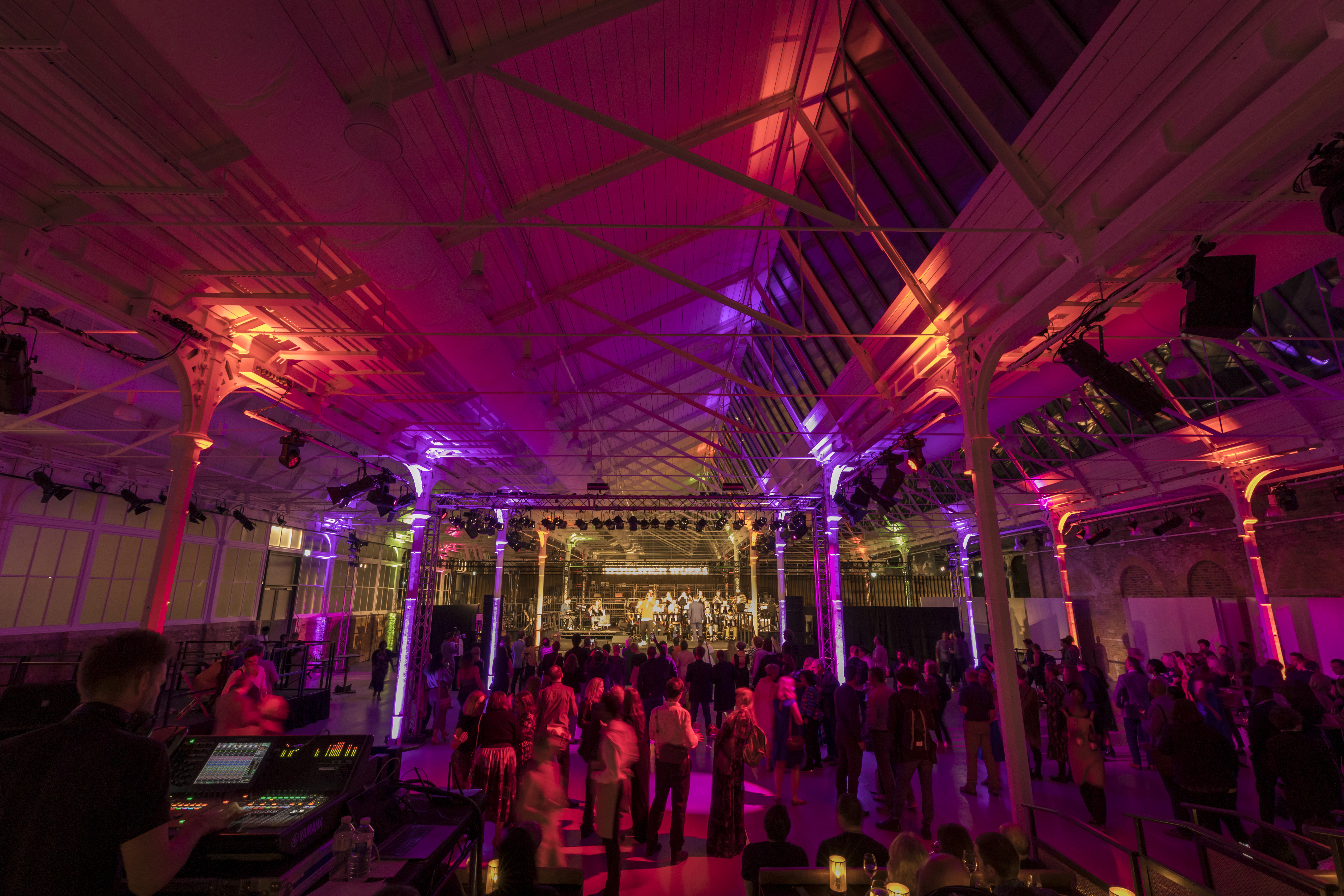 Vibrant Woolwich Works event space with dynamic lighting for successful gatherings.