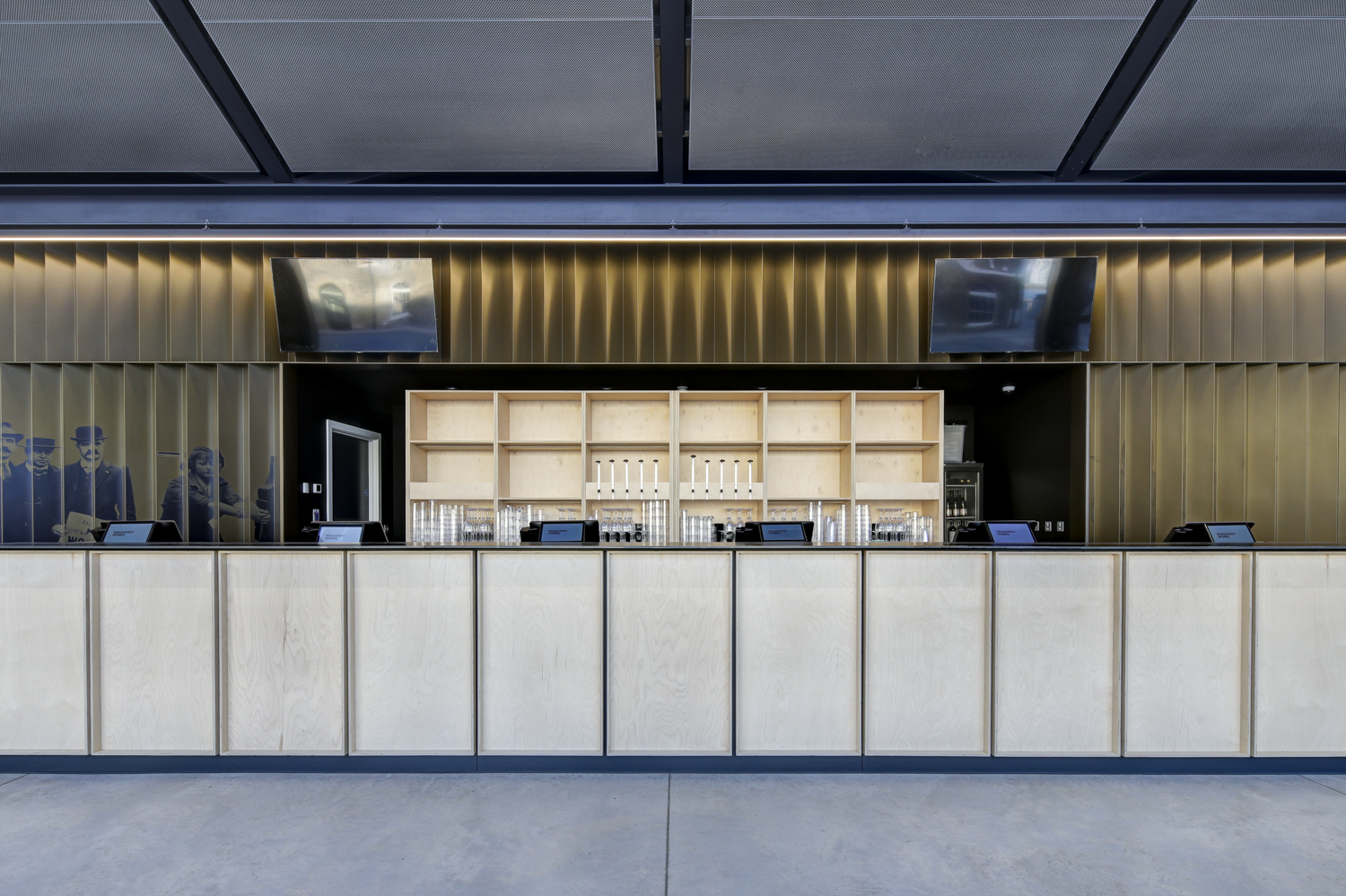 Modern event space at Fireworks Factory, Woolwich Works, ideal for gatherings and presentations.