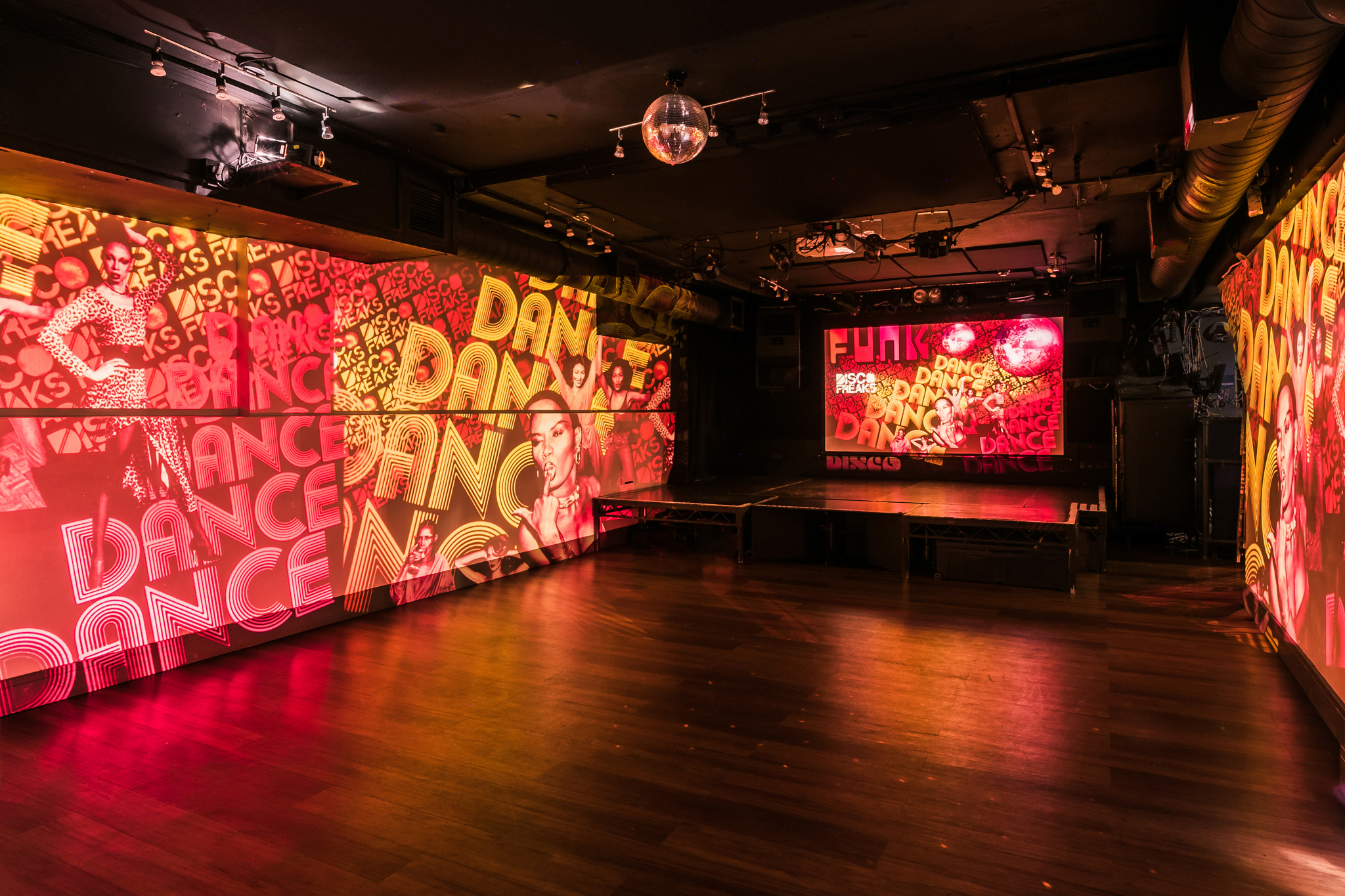 Vibrant event space with colorful projections at Notting Hill Arts Club for dynamic gatherings.