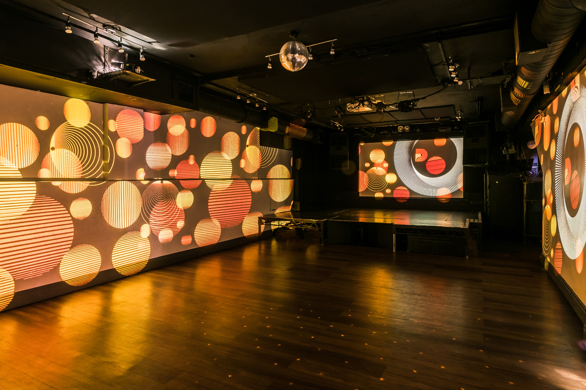 Modern event space in Notting Hill with colorful projections for corporate and social events.