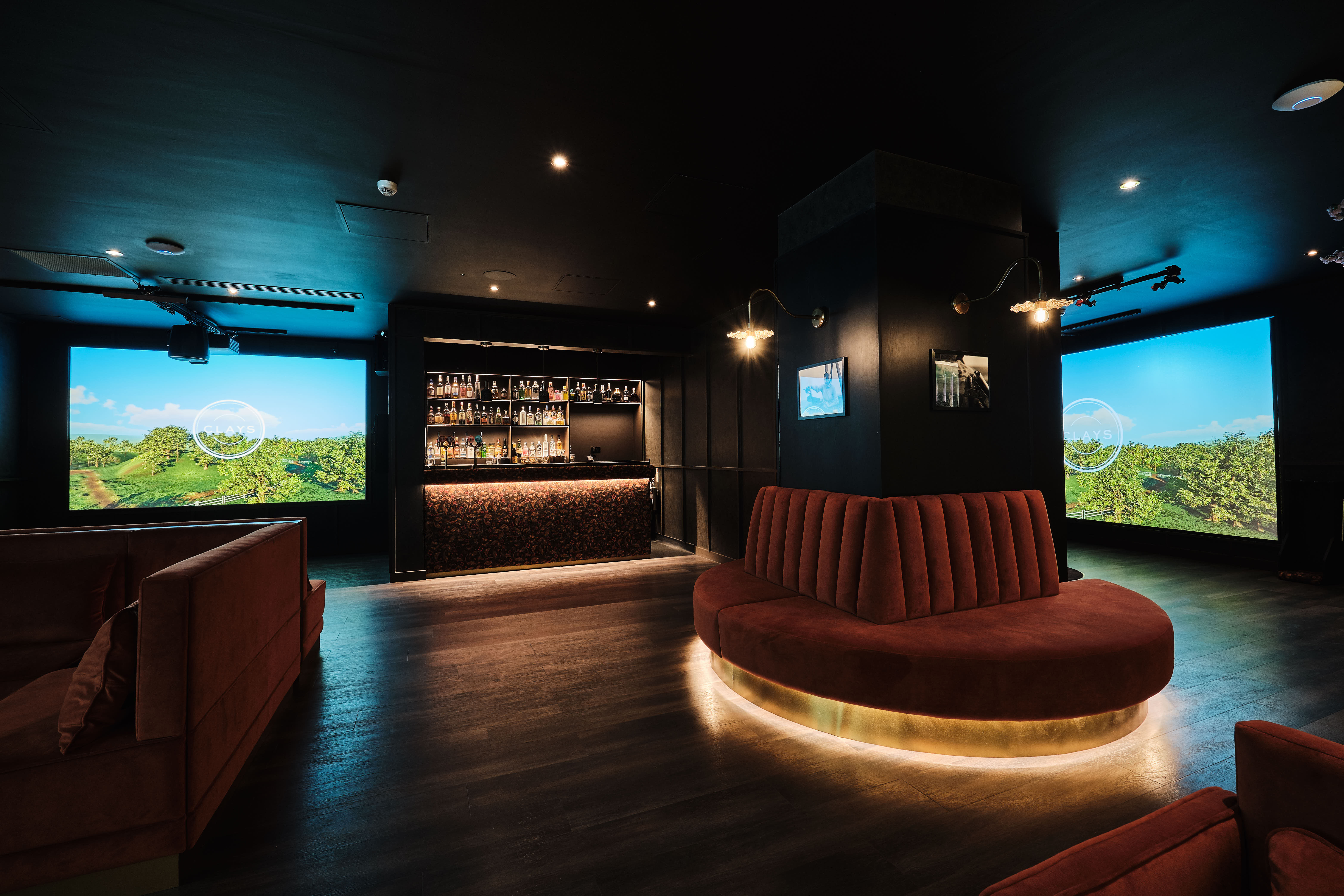 Modern event space with bar and projection screens for corporate events in Moorgate.