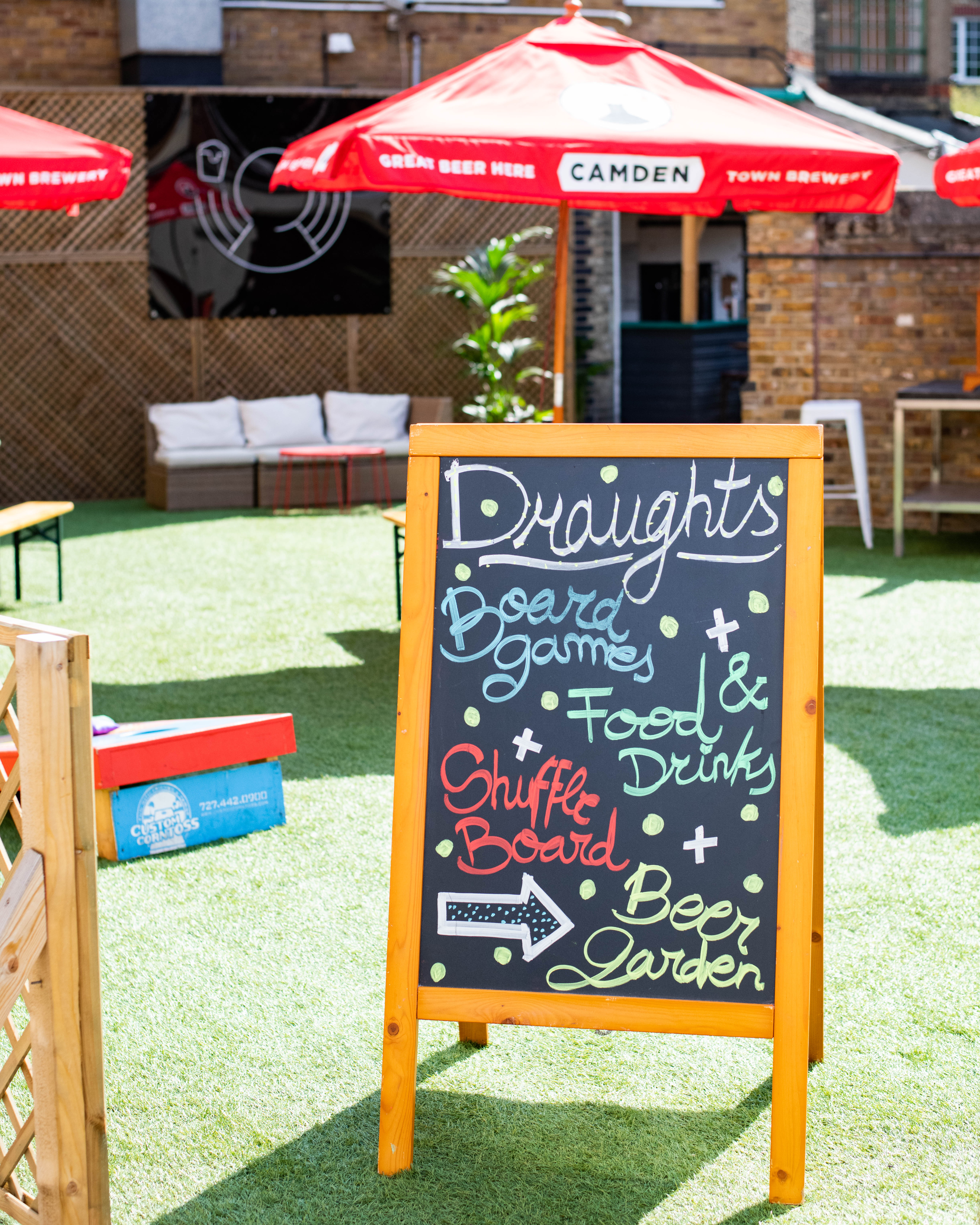 Vibrant outdoor event space at Draughts Hackney for casual networking and team-building.