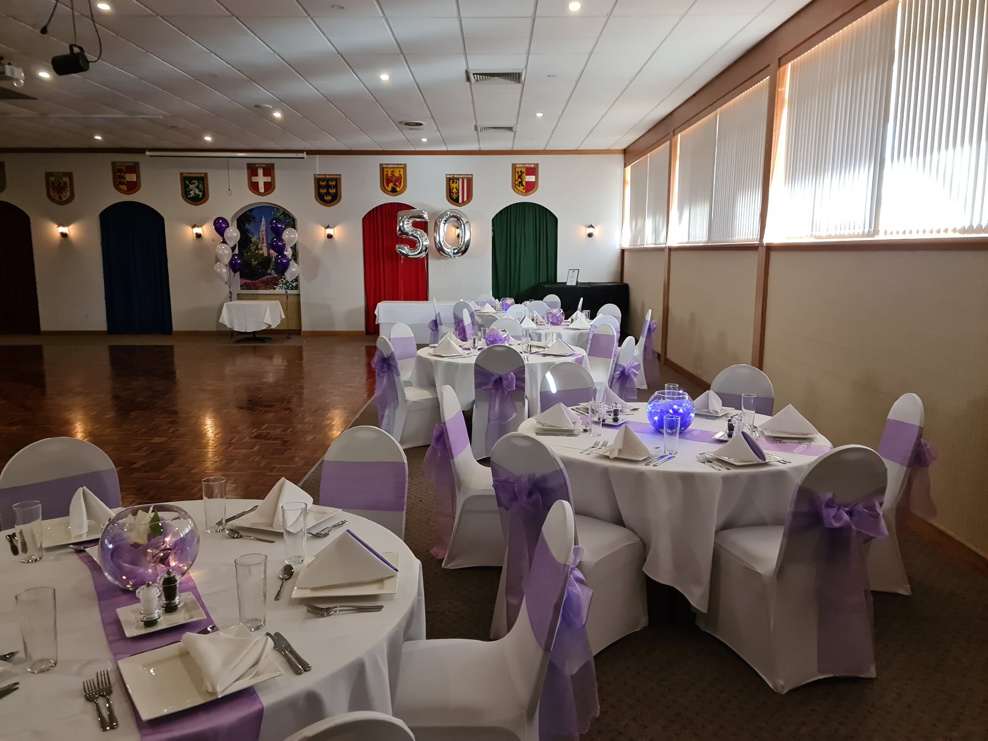 Elegant event space in Austrian Club Canberra, set for formal gatherings with lavender decor.