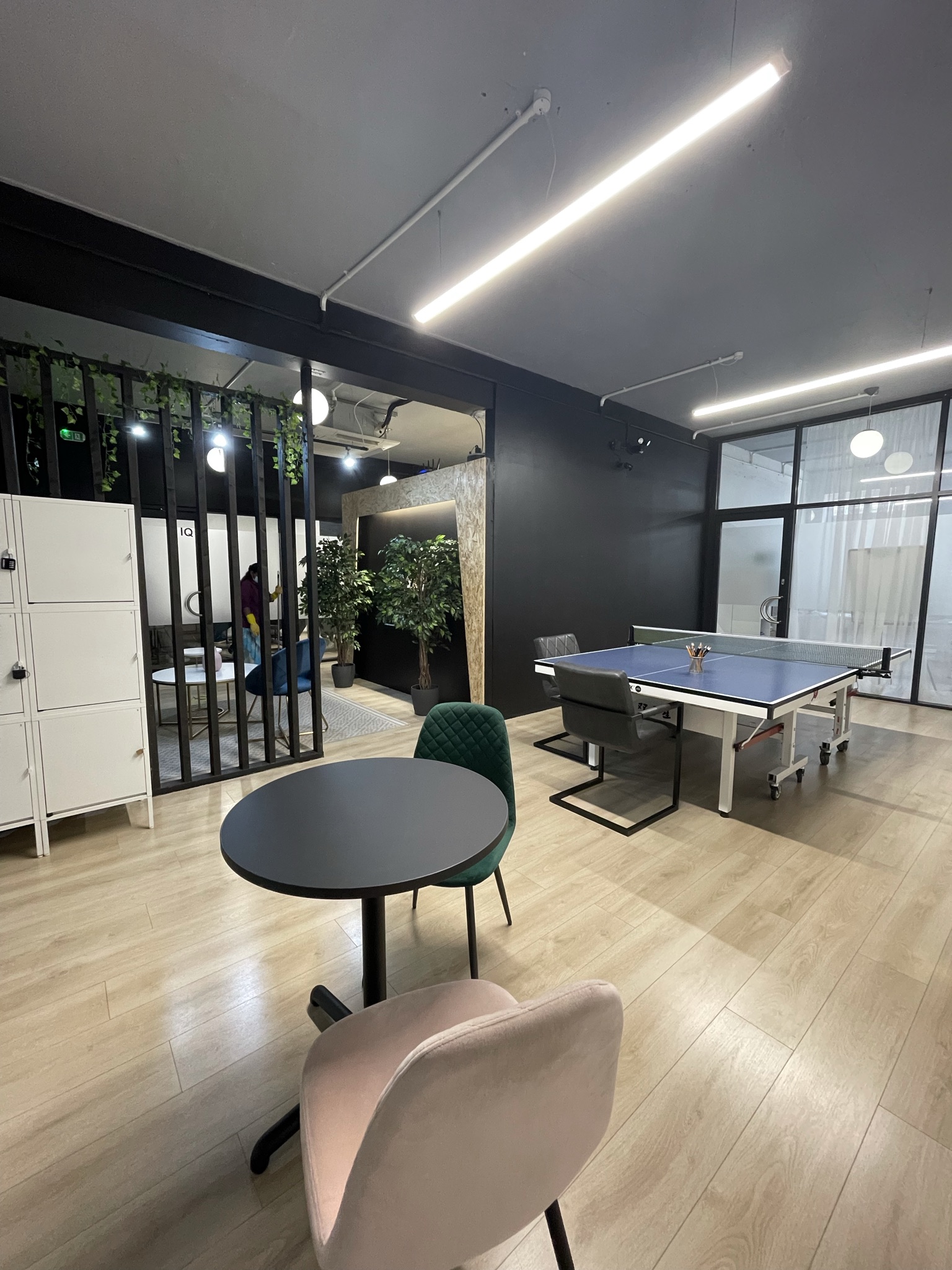 Modern event space with ping pong table for creative meetings and team-building activities.