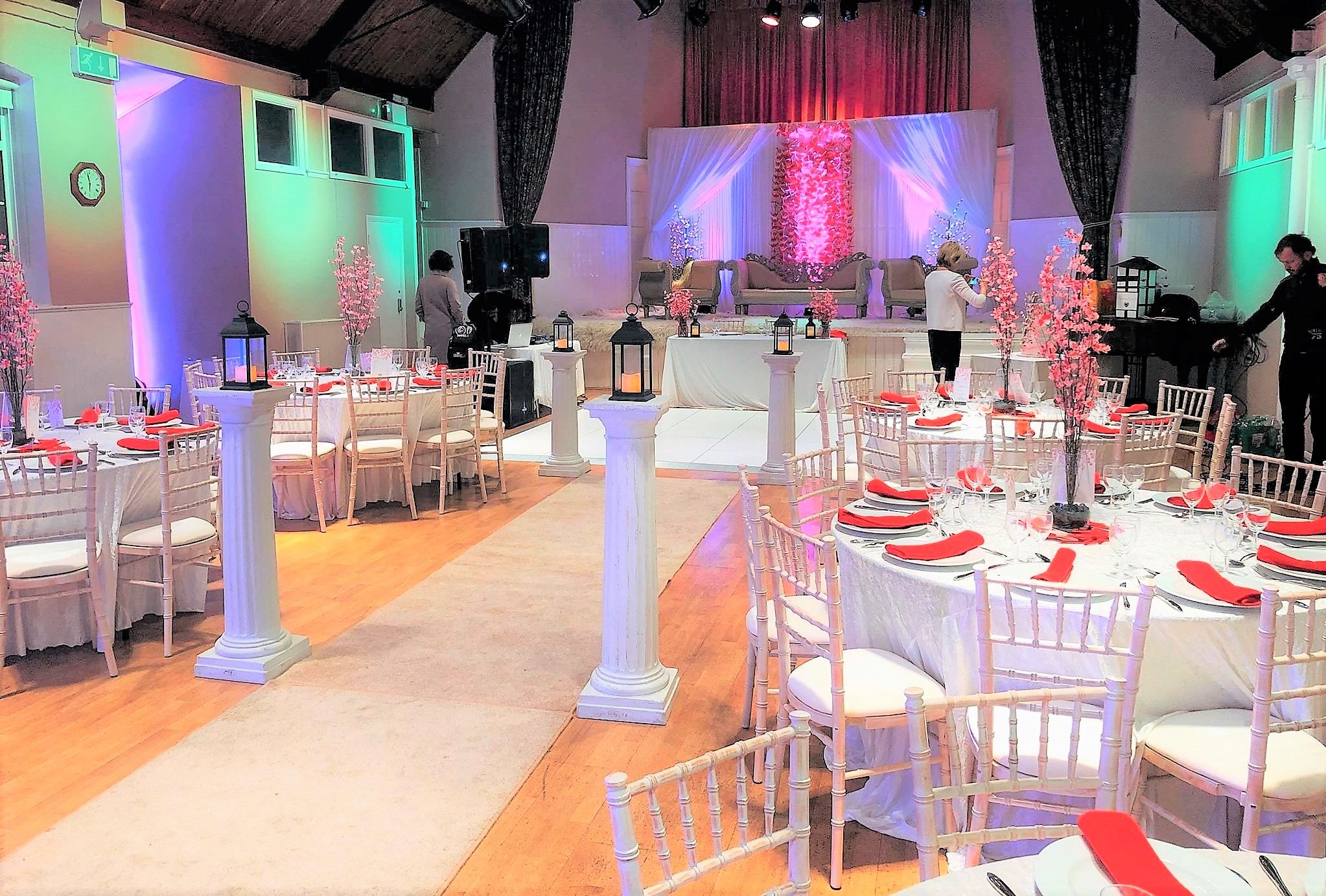 Elegant event space with round tables, perfect for weddings and corporate gatherings.