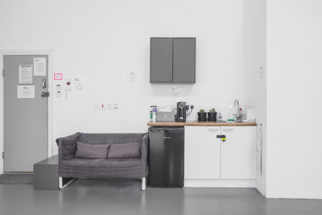 Minimalist break area at Ctrl Creative Camden with cozy couch for meetings and events.