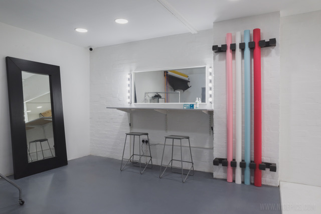 Event preparation area with vanity mirror, ideal for makeup and photo shoots.