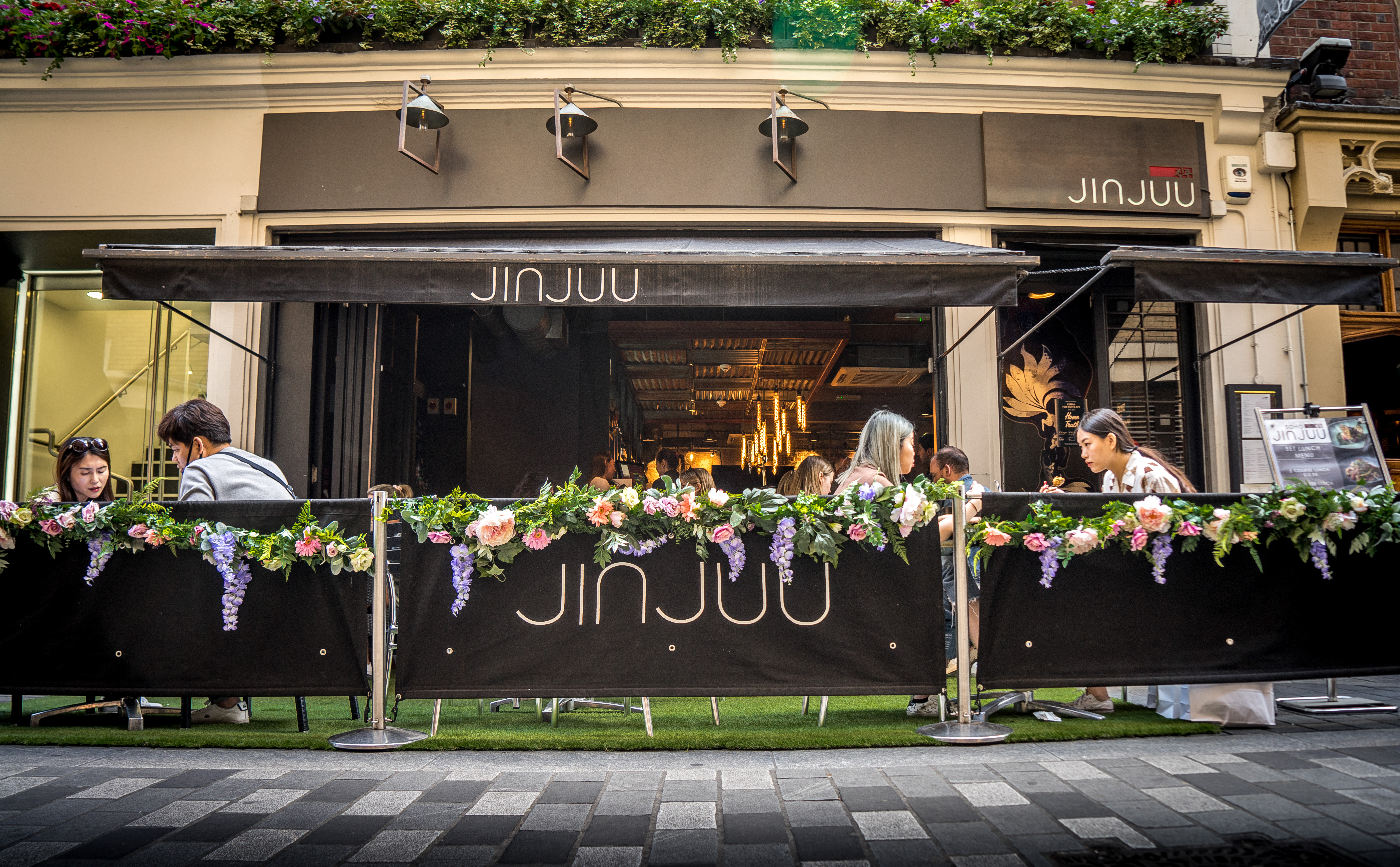 Vibrant outdoor dining at Jinjuu Soho, perfect for casual meetings and networking events.