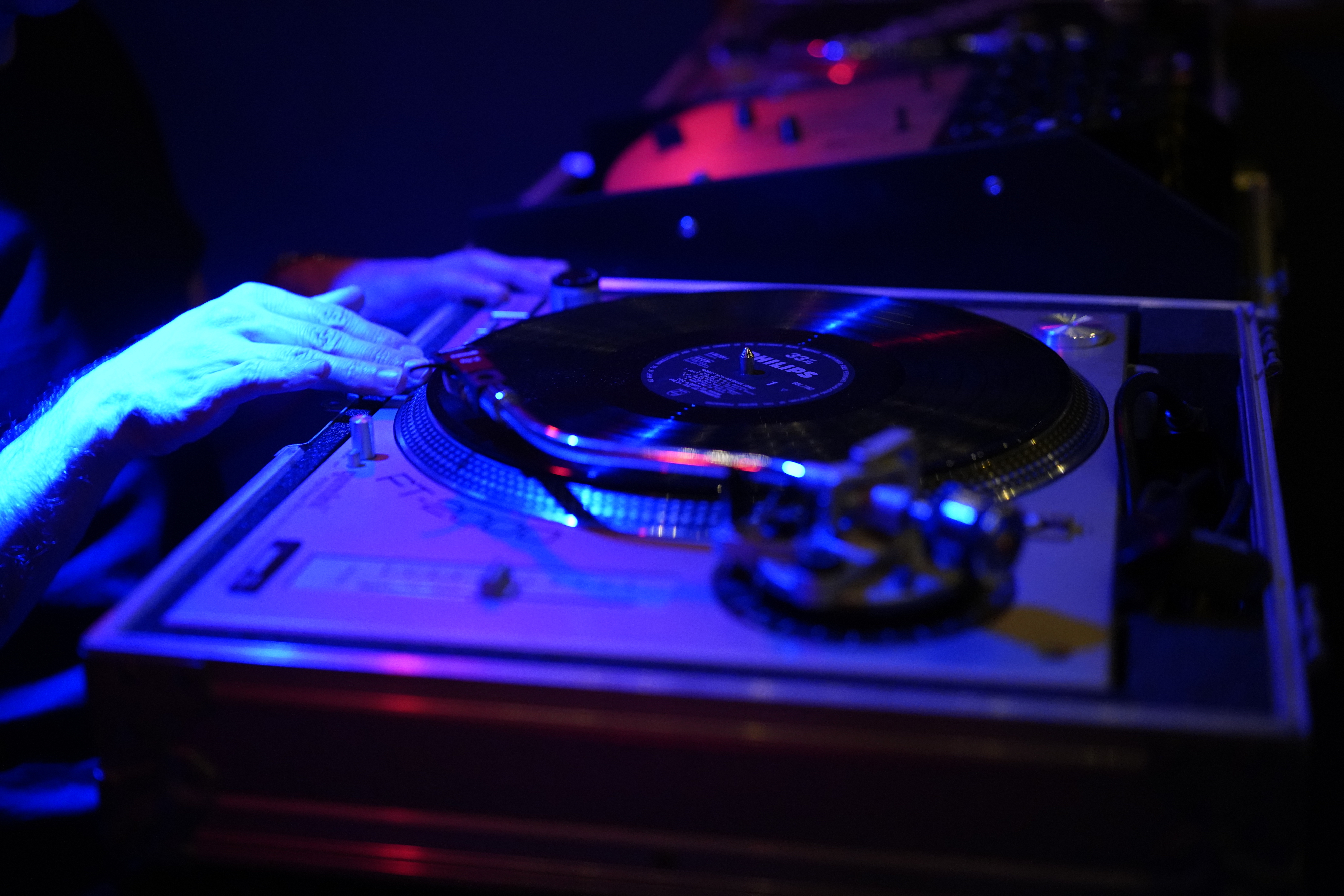 DJ mixing tracks at Lagos Bar, vibrant lighting for lively events and entertainment.