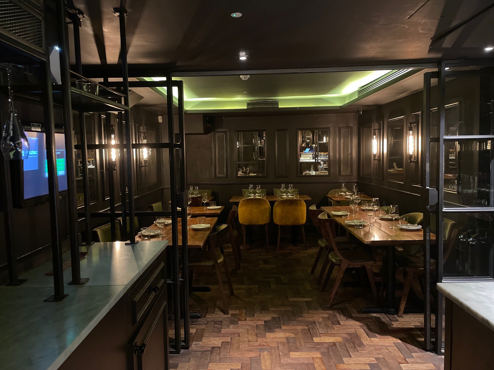 Private dining room at Ember Yard, elegant decor for events and meetings.