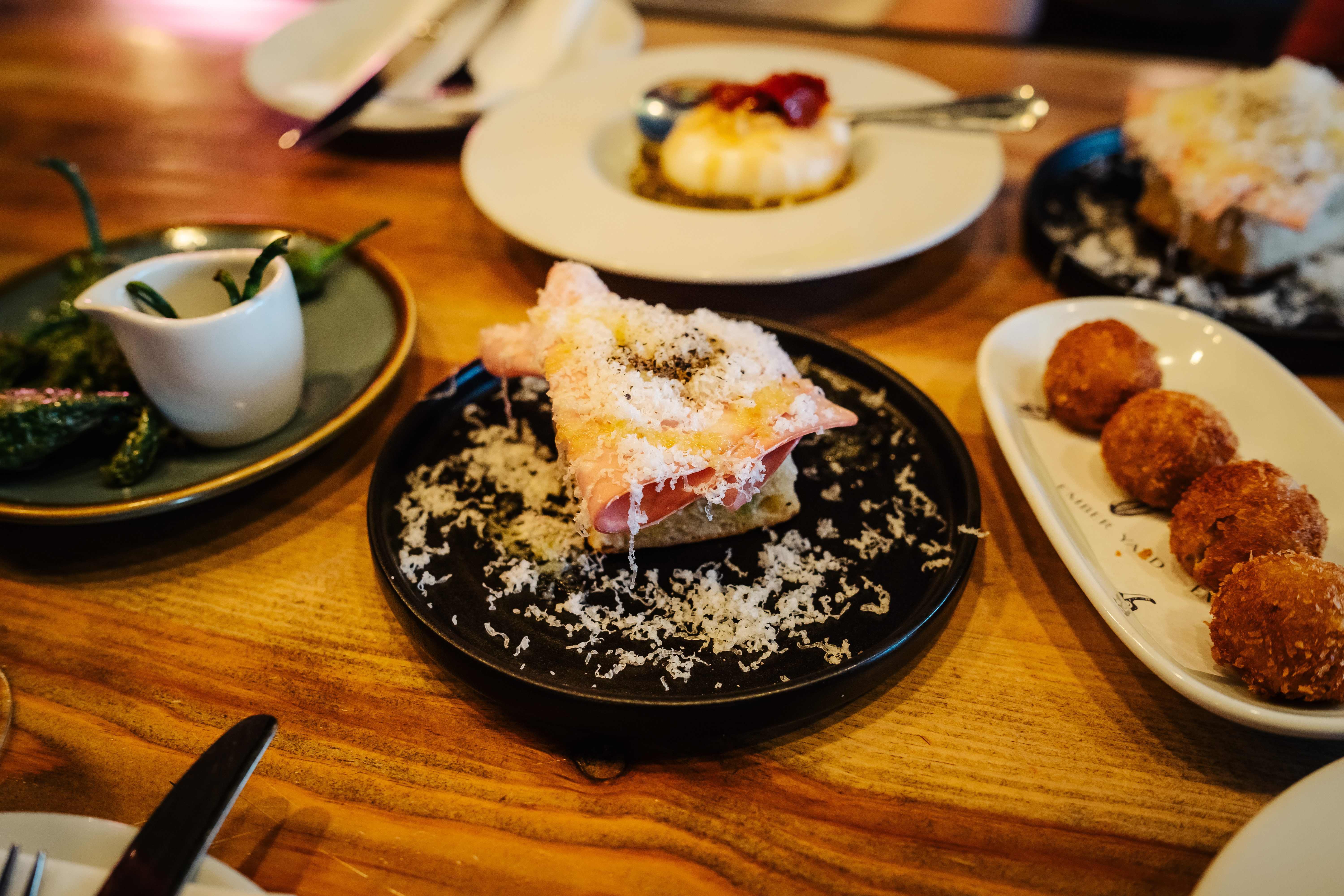 Private dining room with gourmet dishes for corporate events and galas.