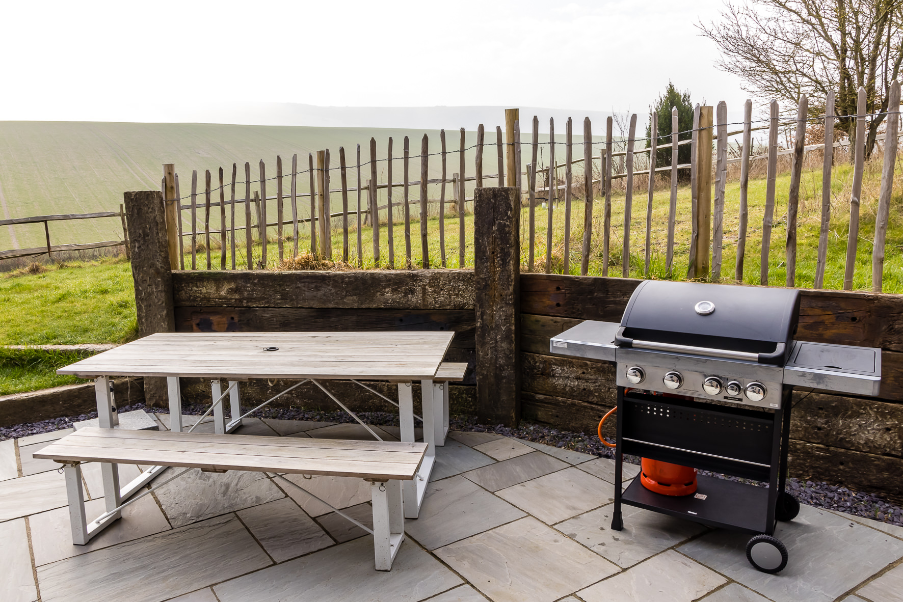Outdoor venue at The Grain Store Lewes with grill, ideal for casual gatherings and team-building.