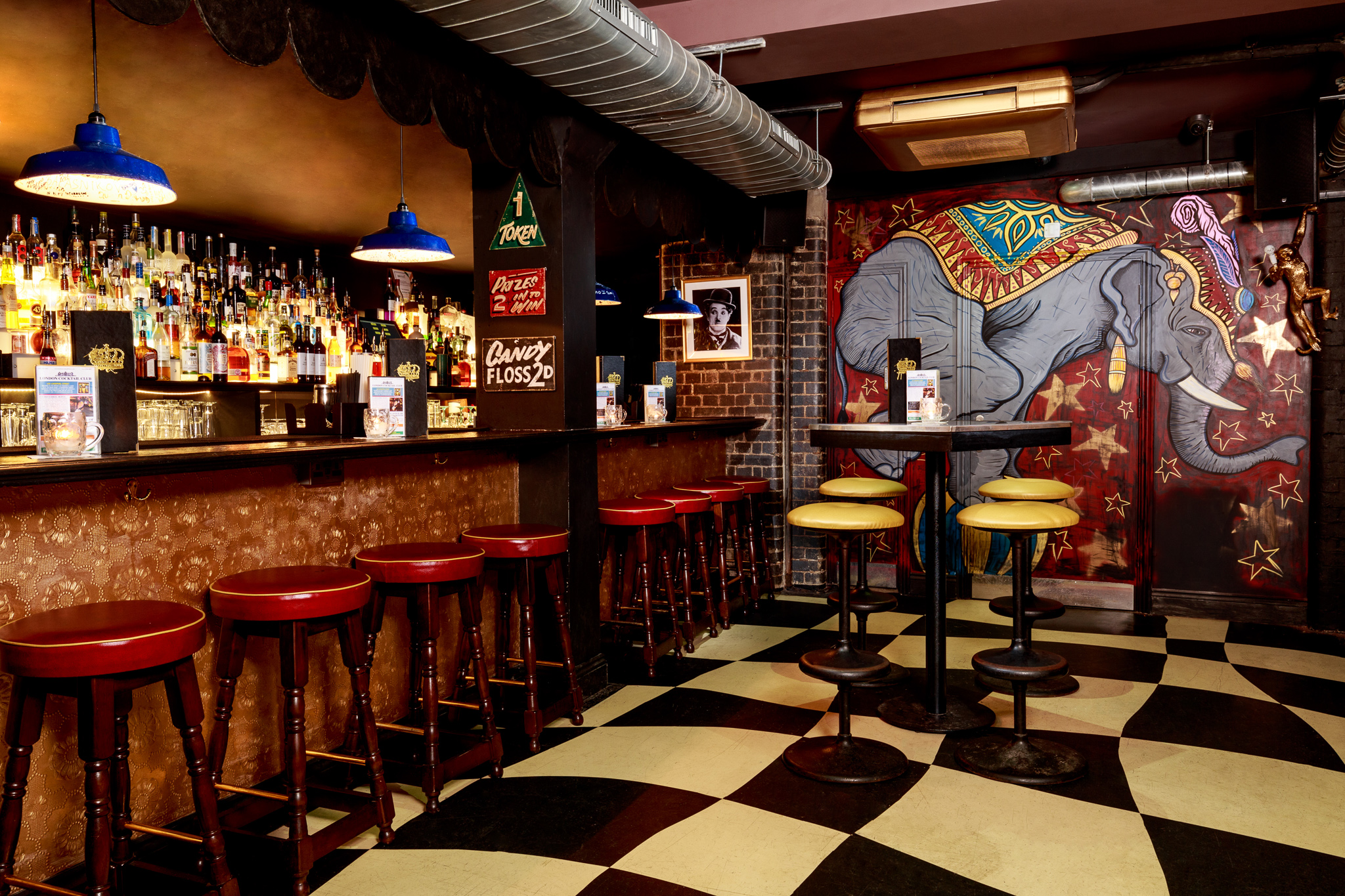 Vibrant bar venue with elephant mural, perfect for networking events in Liverpool Street.
