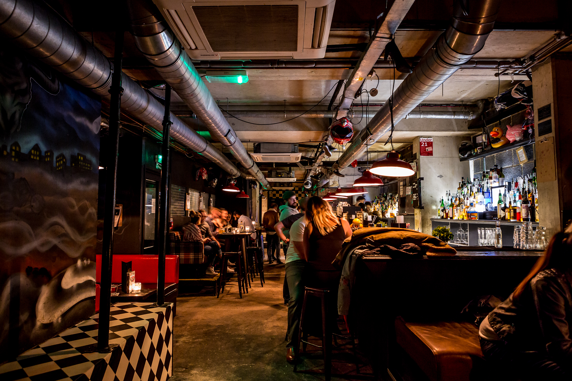 Vibrant bar venue with industrial decor for networking events in Liverpool Street.