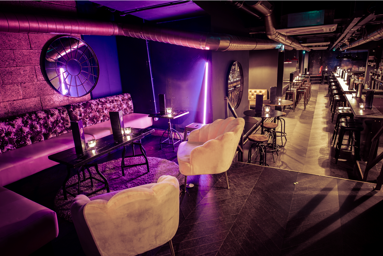 Chic event space in The Cocktail Club Shoreditch with plush seating for gatherings.