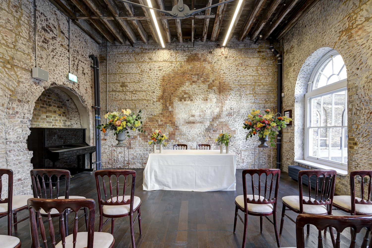 Knight Gallery event space with mural, ideal for weddings and gatherings.