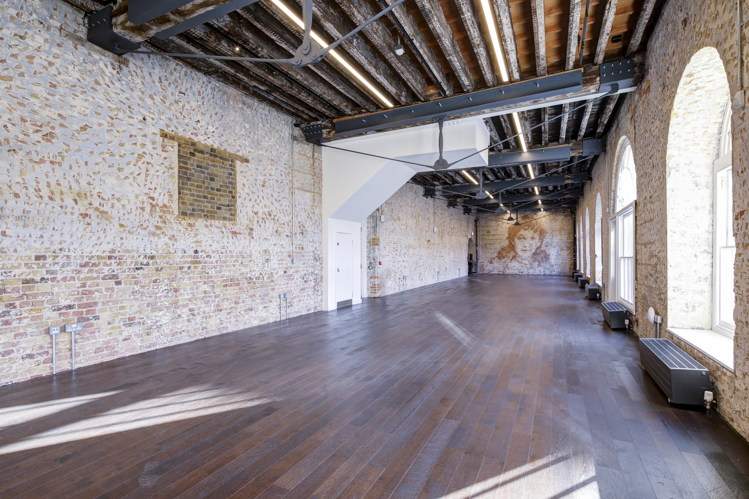 Spacious Knight Gallery venue with exposed brick, perfect for corporate and private events.