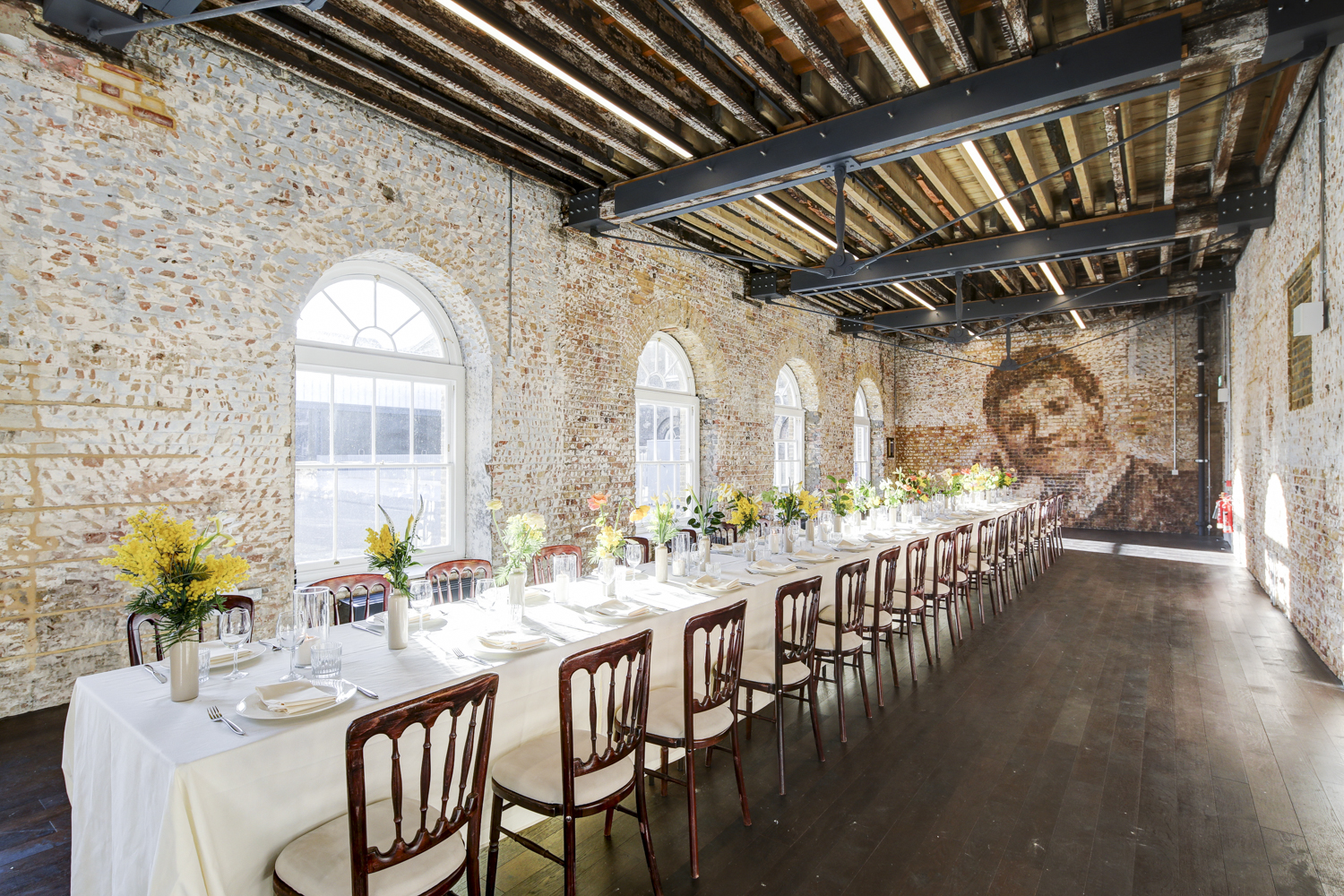 Elegant event space at Knight Gallery with floral centerpieces and rustic charm.