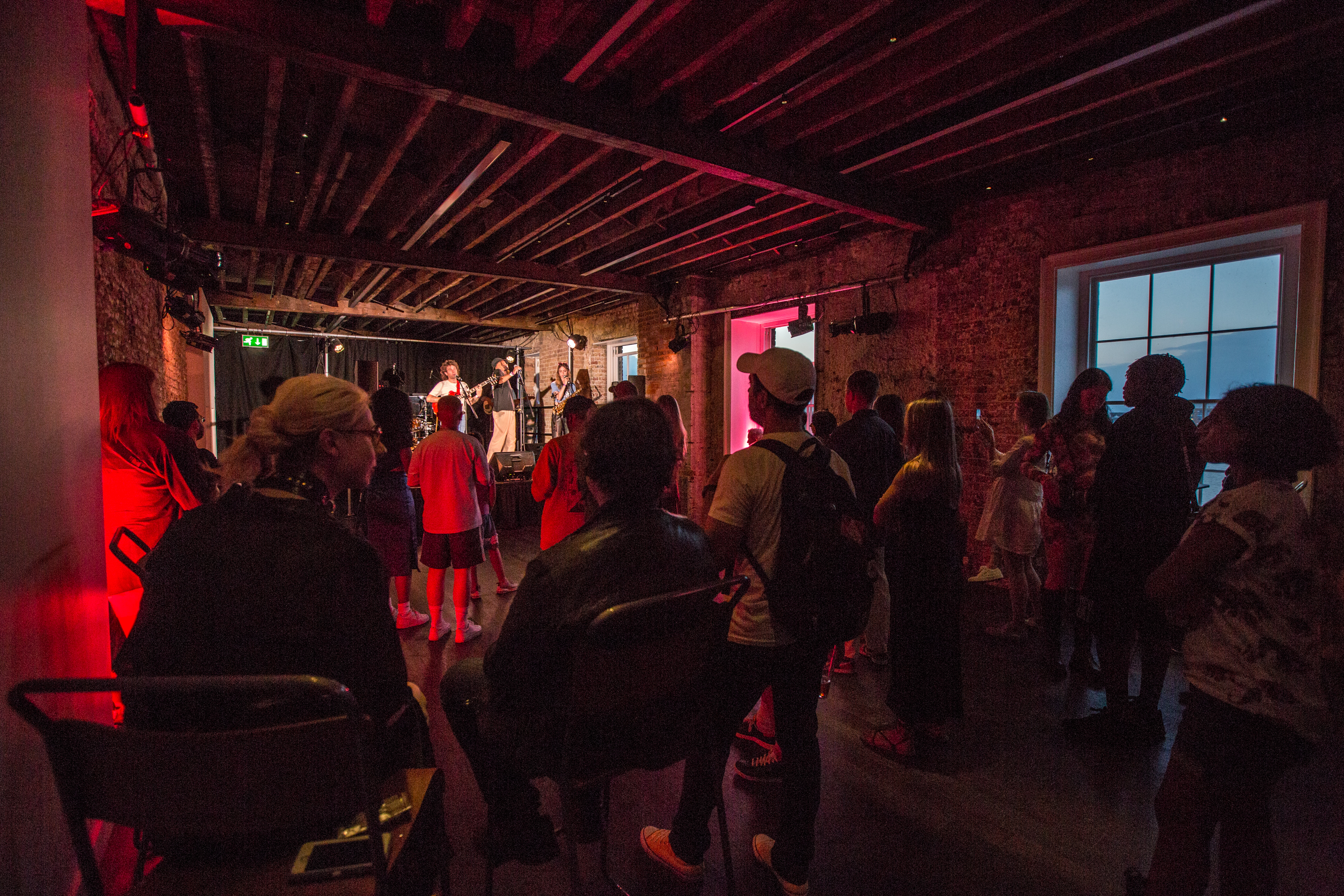 Vibrant Beanfeast event in Woolwich Works with live performance and engaging atmosphere.