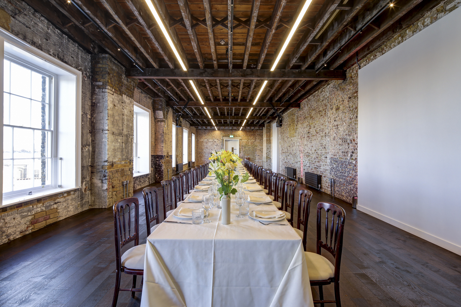 Elegant event space at Beanfeast, Woolwich Works, perfect for formal dinners and meetings.