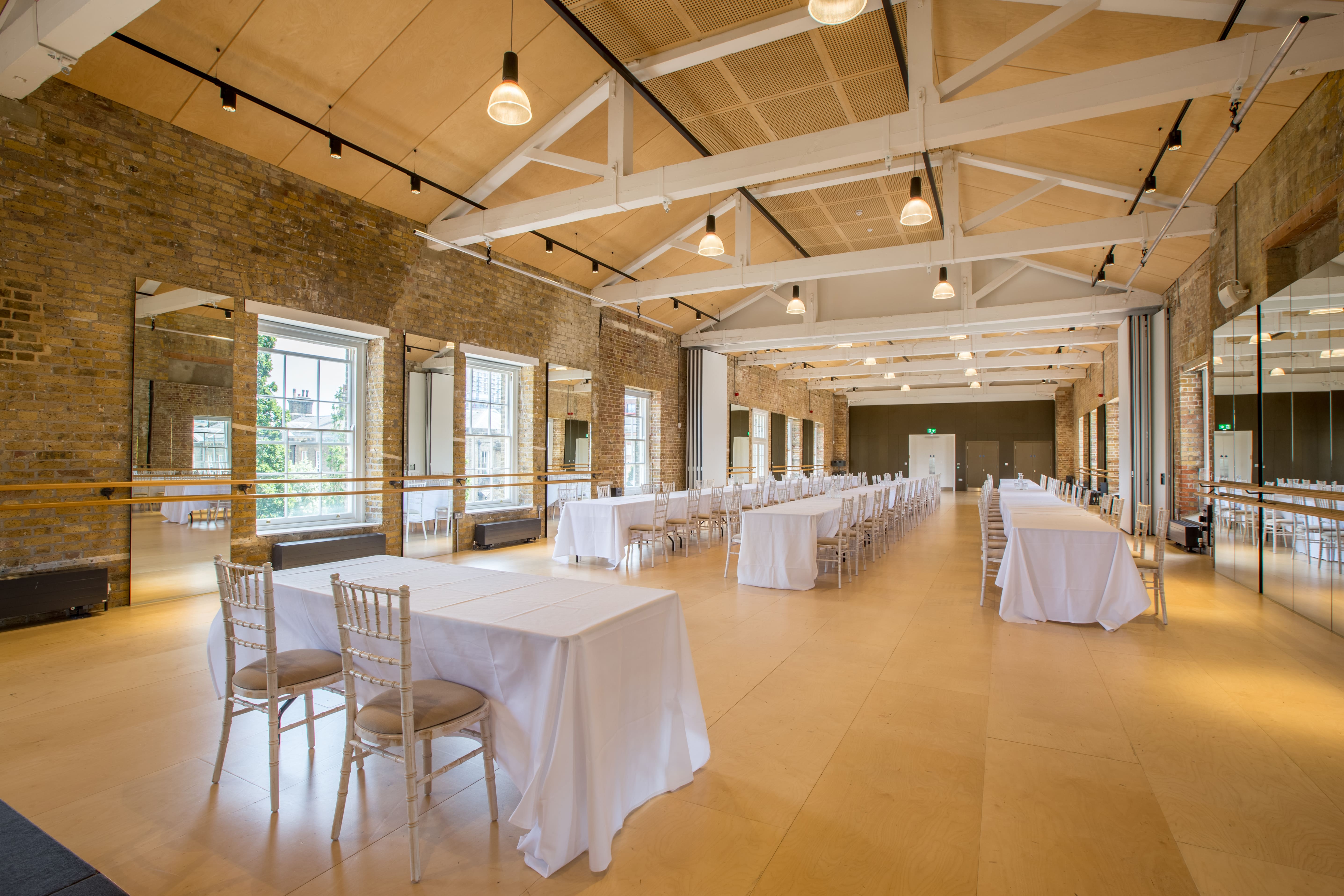 Versatile event space with natural light, ideal for meetings and workshops in Woolwich Works.