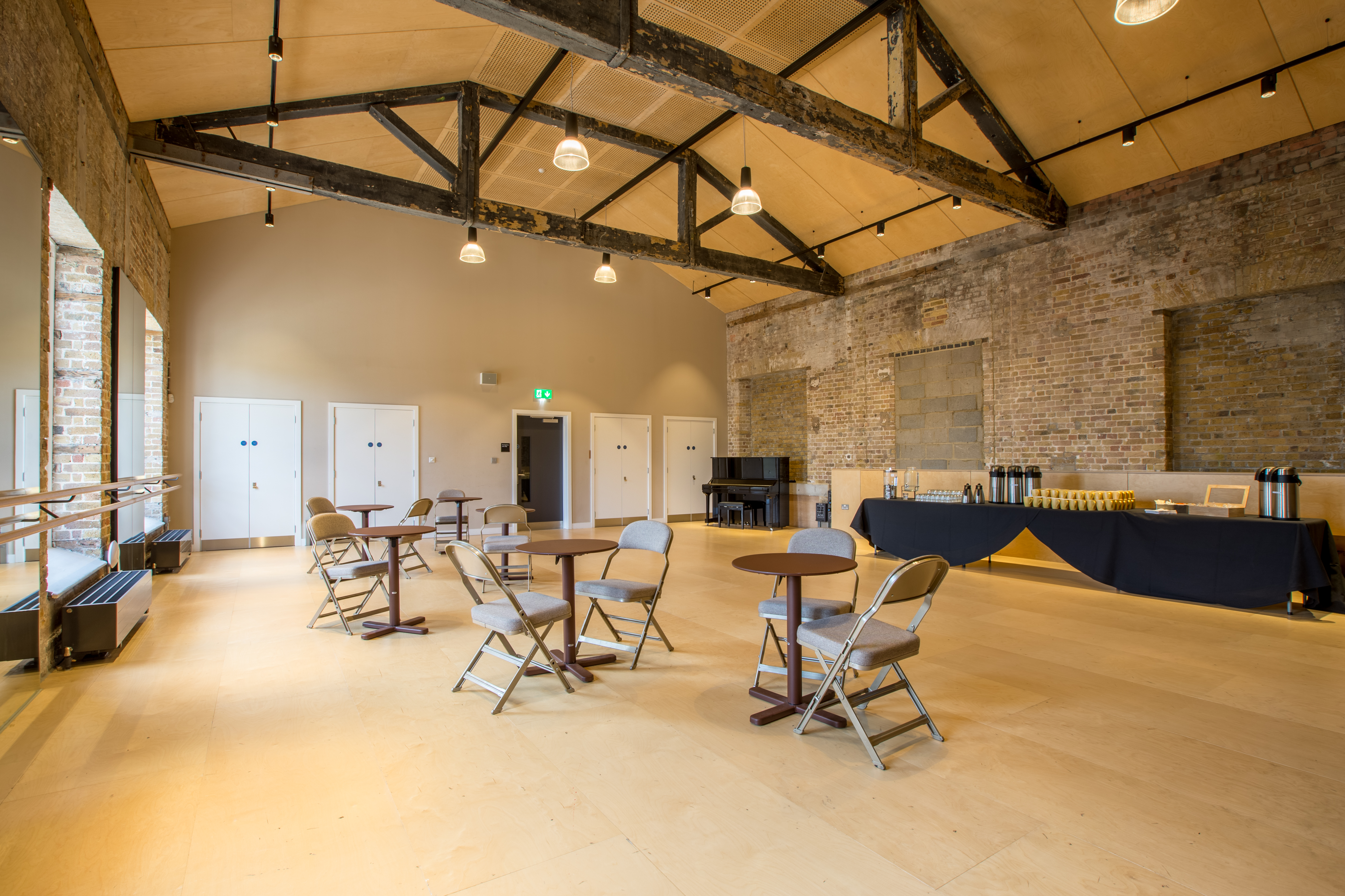 Coopers Studio event space with high ceilings, ideal for meetings and gatherings.