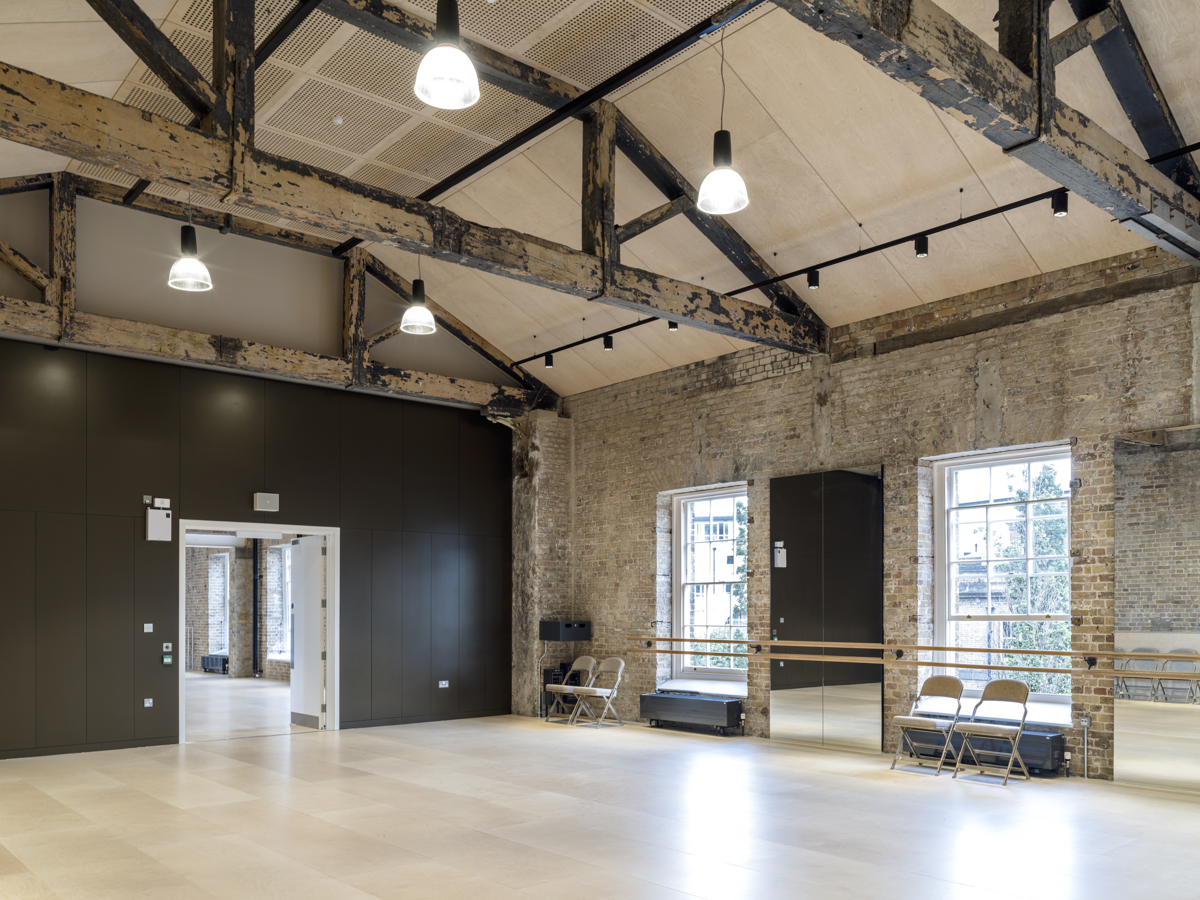 Coopers Studio event space with exposed beams, ideal for workshops and gatherings.