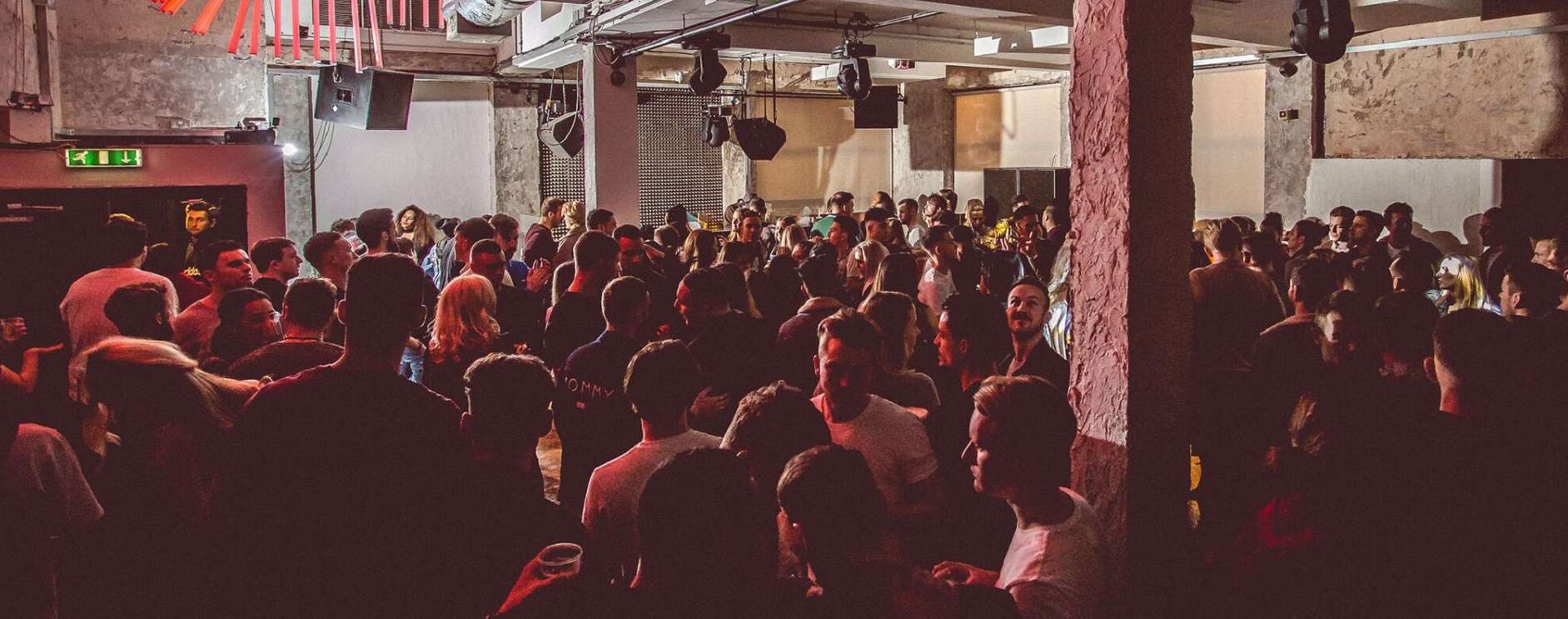 Vibrant crowd at 93 Feet East event, showcasing lively atmosphere for networking and entertainment.