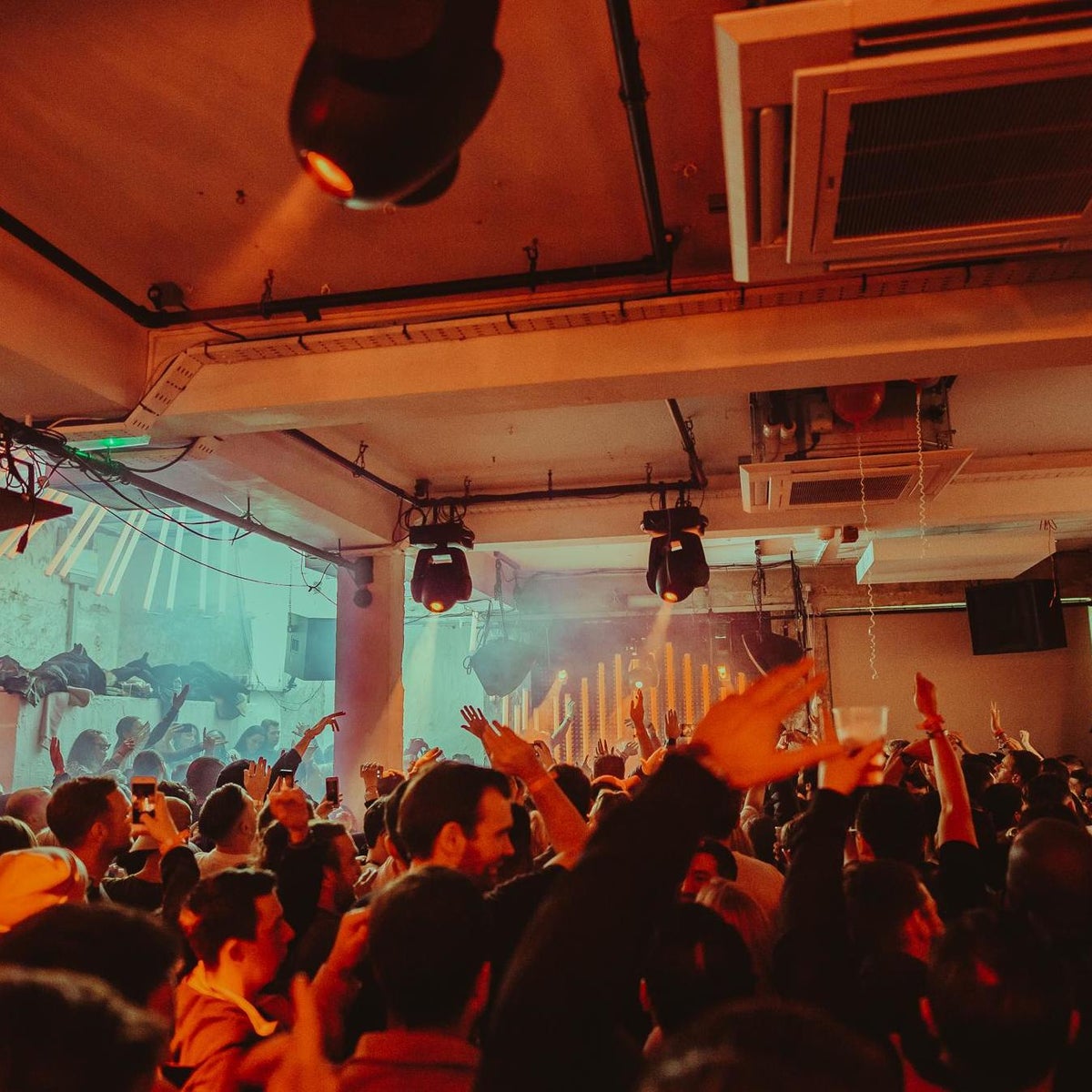 Vibrant event space at 93 Feet East with energetic crowd, ideal for concerts and gatherings.