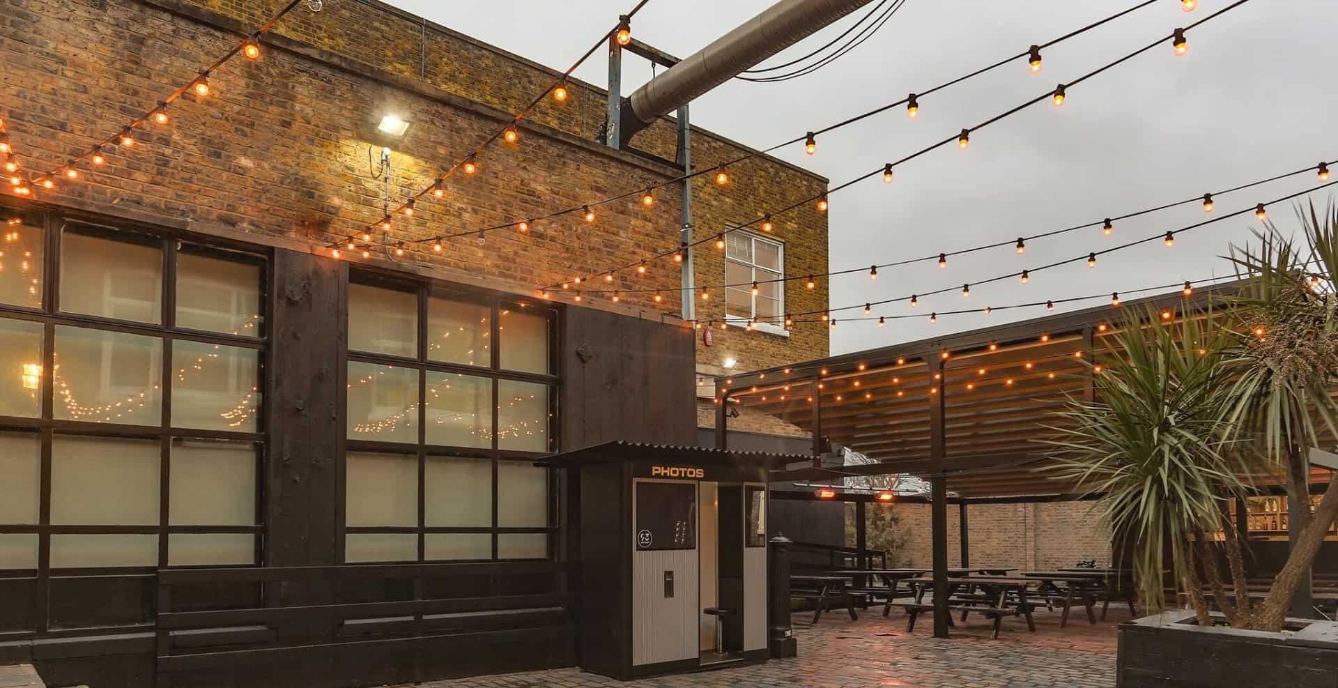 Outdoor event space at 93 Feet East with string lights for gatherings and parties.