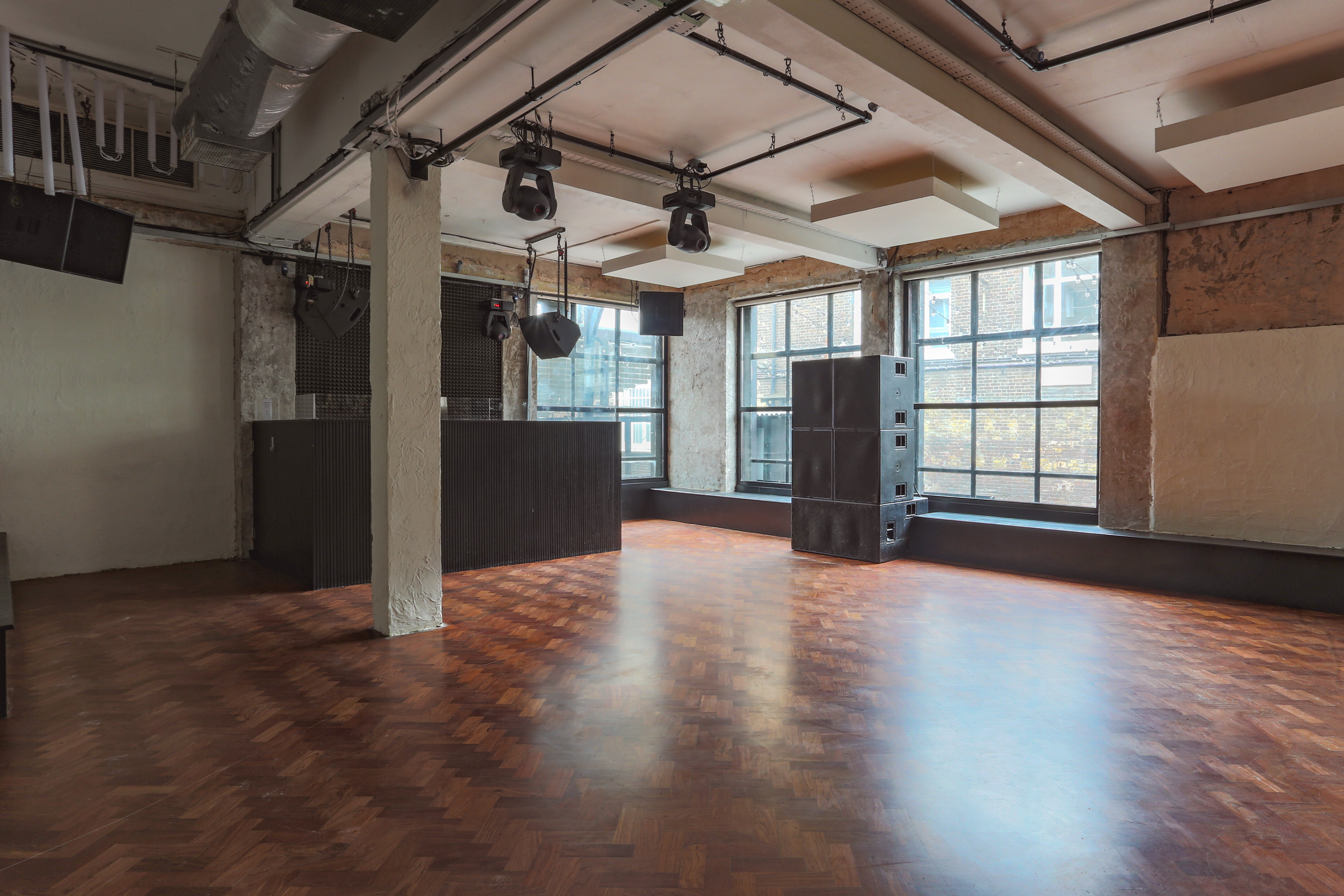 Main Party Area at 93 Feet East, versatile event space with polished flooring for gatherings.