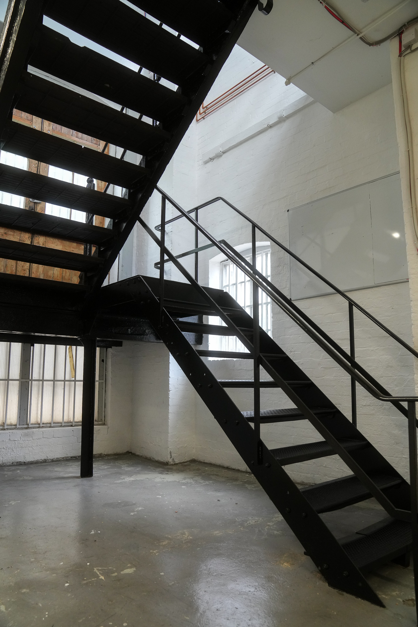Black metal staircase in Mello Studios Hackney, ideal for creative events and networking.