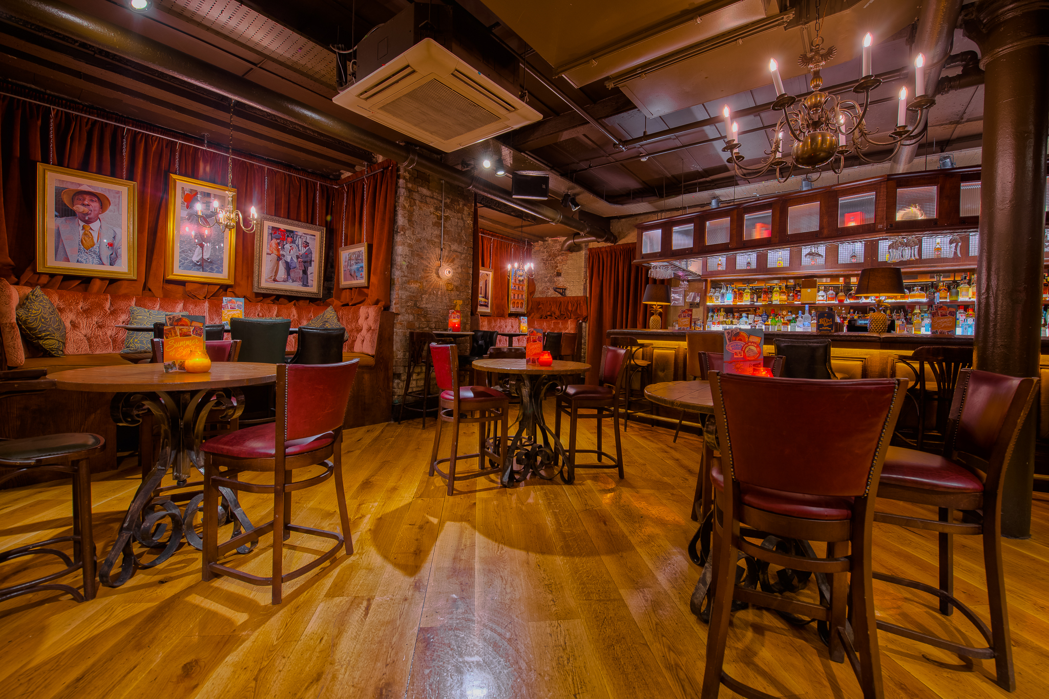 Stylish Santiago Bar event space with wooden floors, ideal for gatherings and networking.