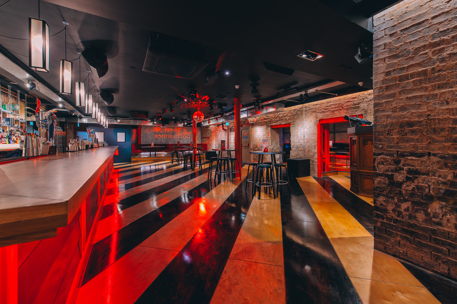 Stylish event space in Glasgow with sleek bar, ideal for networking and social gatherings.