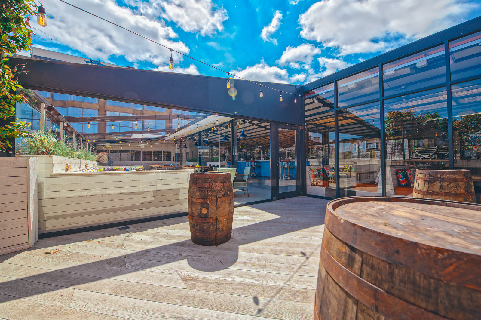 Santiago Sun Terrace: modern outdoor event space with glass panels, ideal for gatherings.