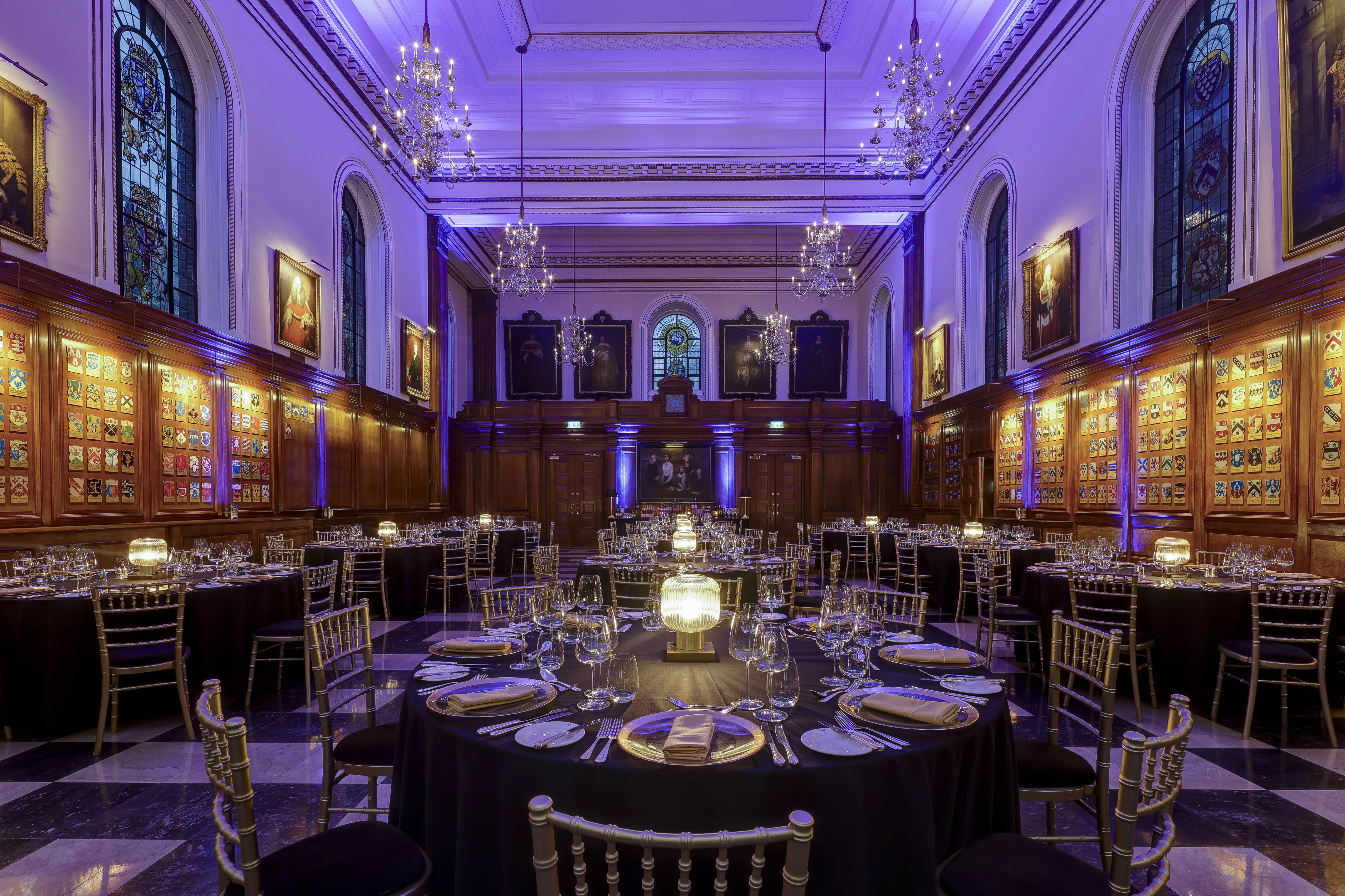 Elegant banquet hall with black linens, ideal for formal dinners and corporate events.