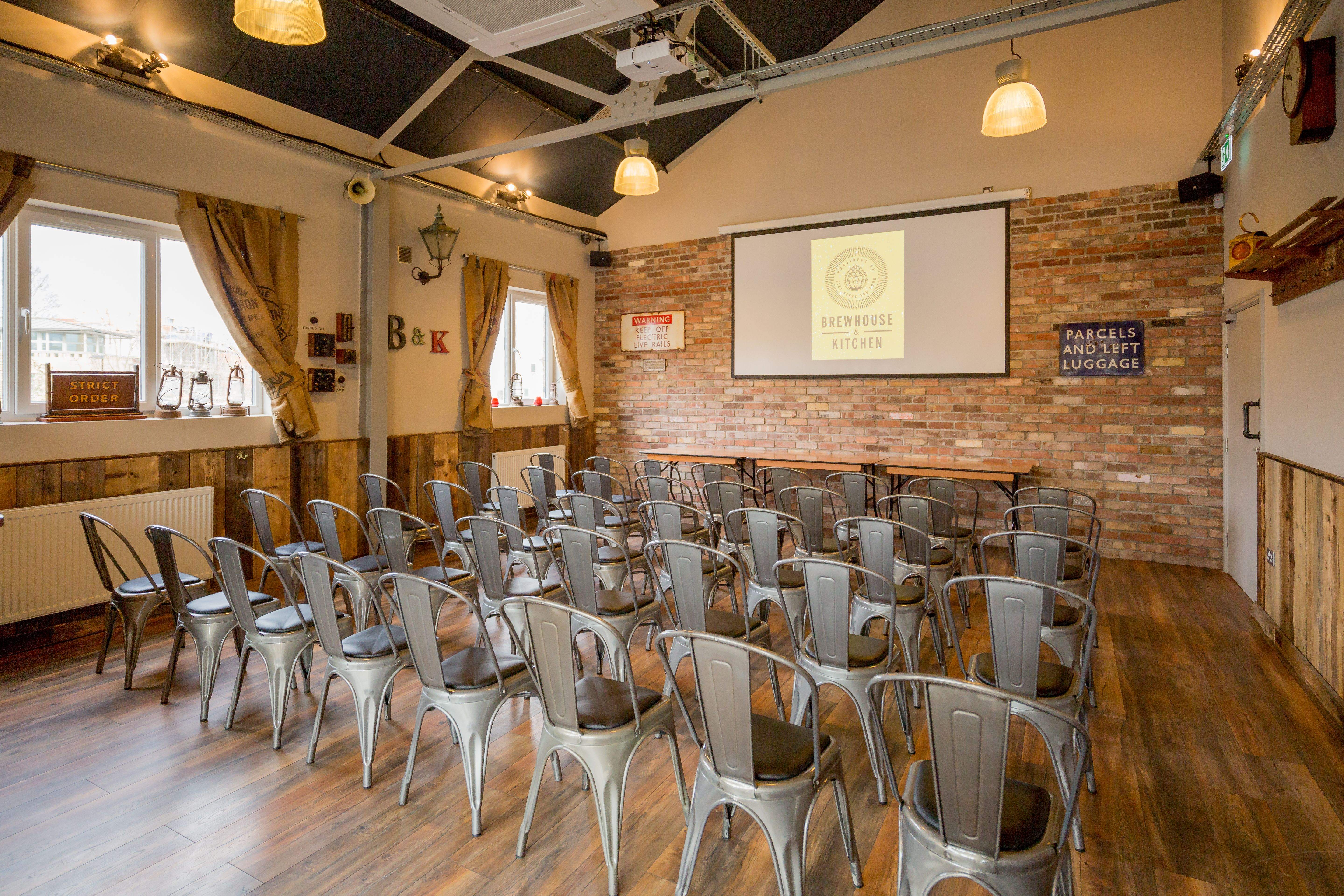 Event space in Brewhouse & Kitchen Highbury with metal chairs for presentations.