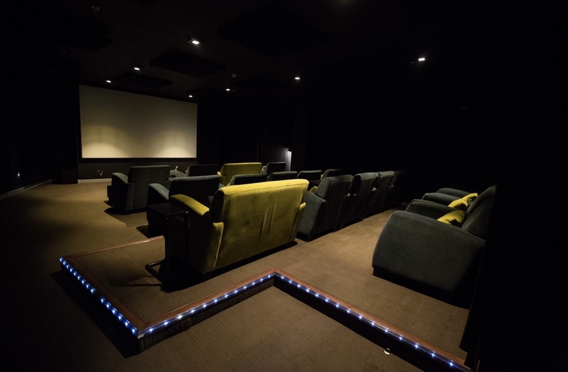Modern cinema room with plush seating for corporate events and private screenings.