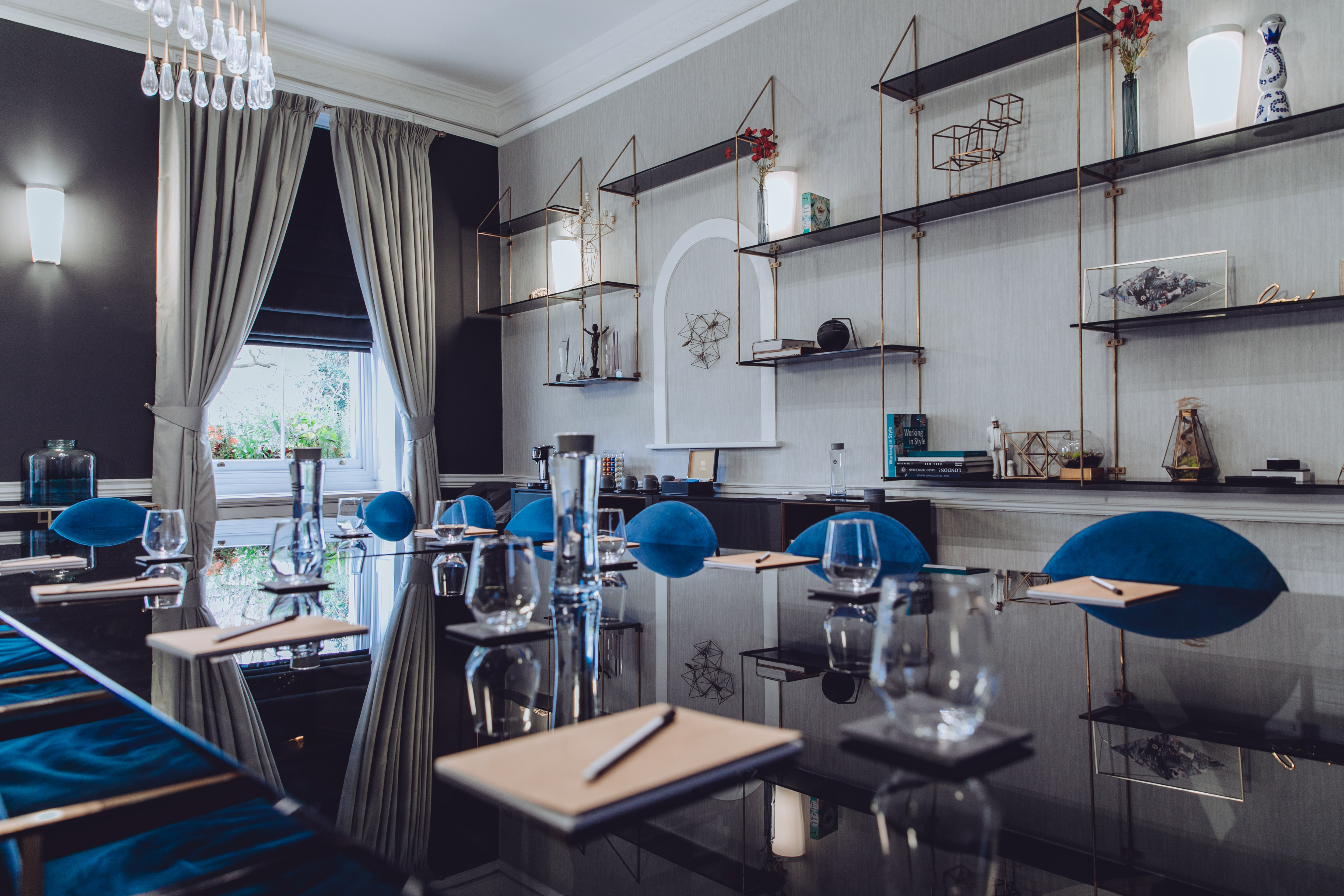 Sophisticated meeting room with sleek table, ideal for corporate events and strategic meetings.