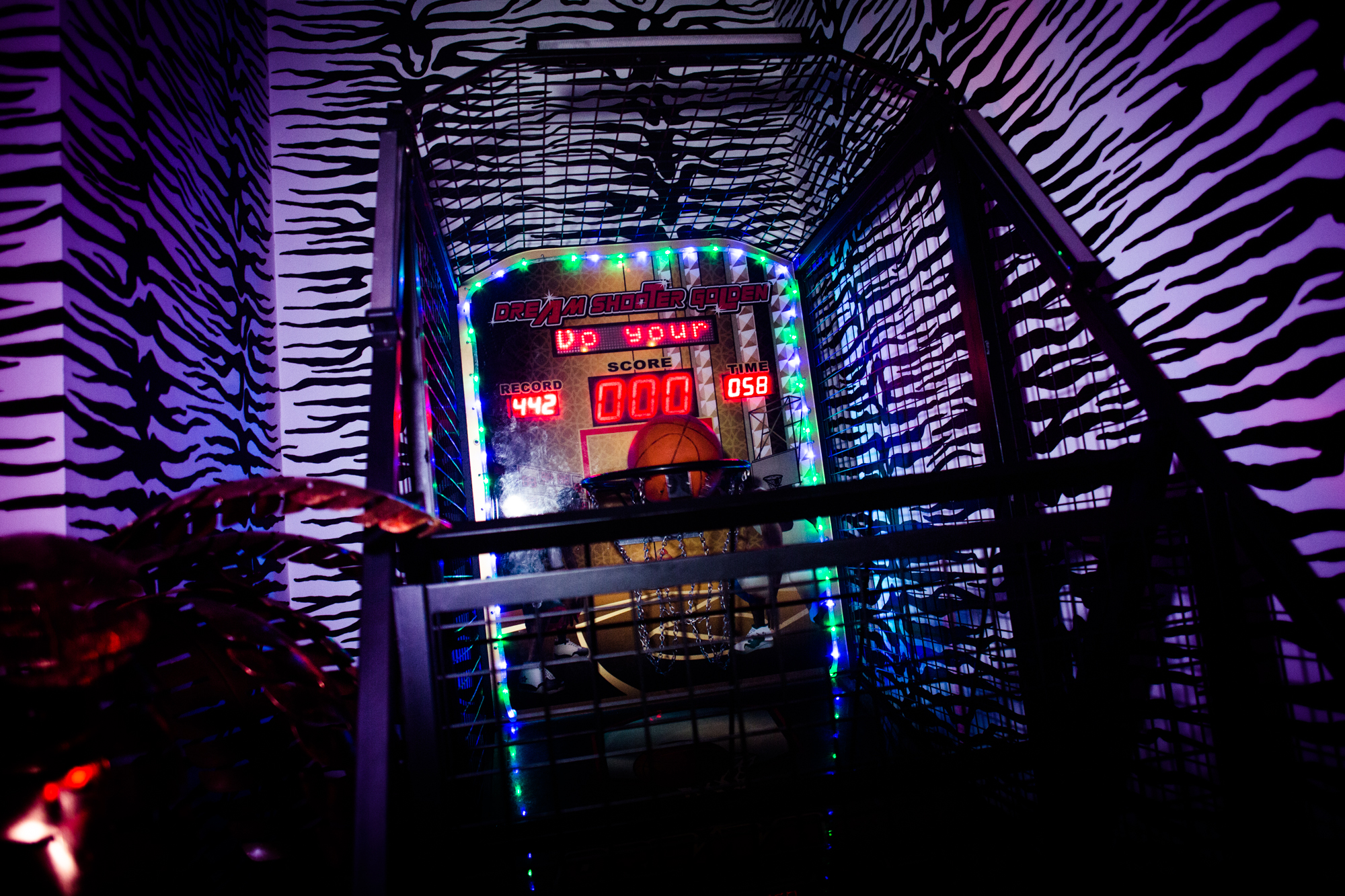 Neon-lit arcade game at Wyld Club, perfect for corporate events and parties.