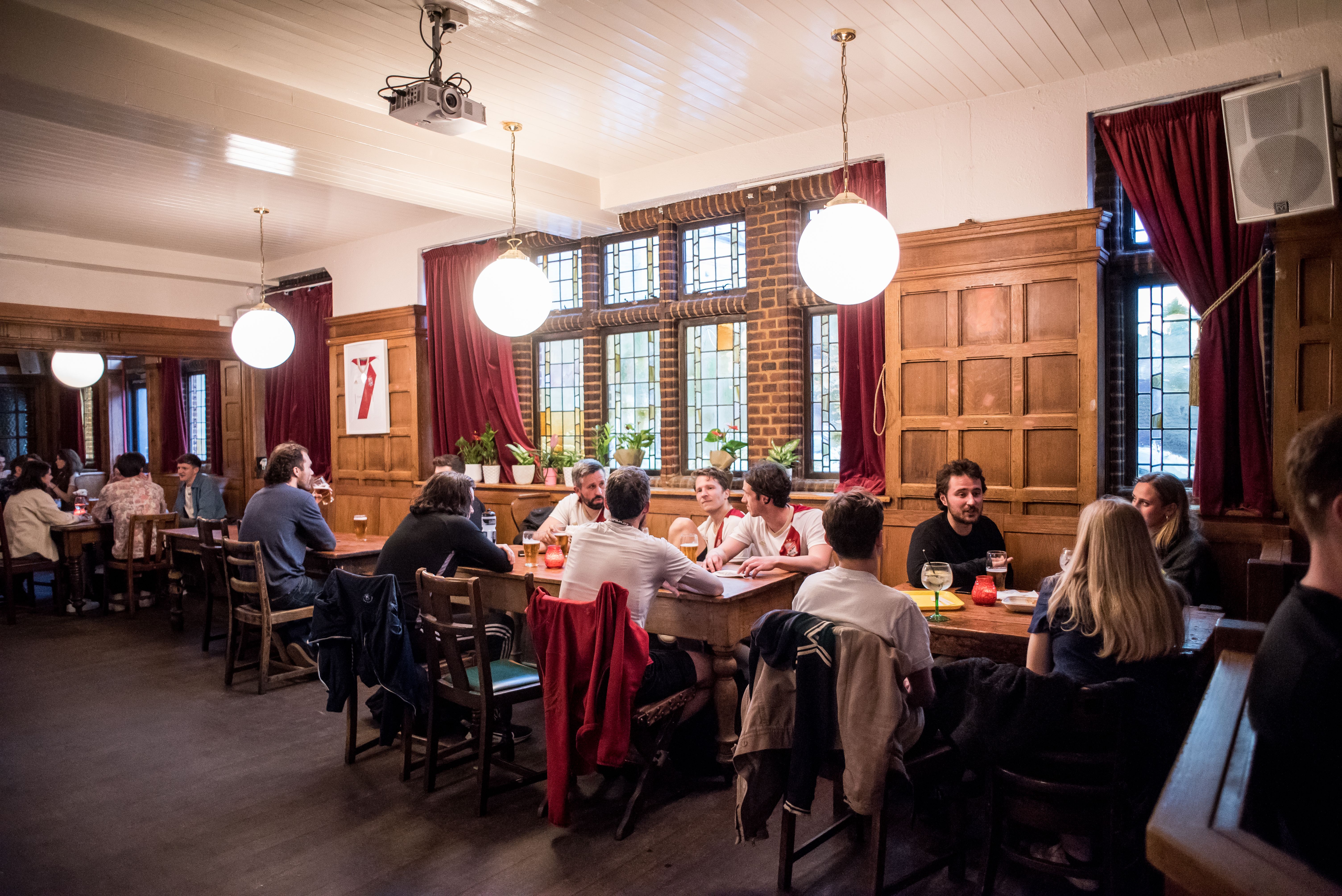 Vibrant networking space with warm lighting, ideal for casual meetings and events.