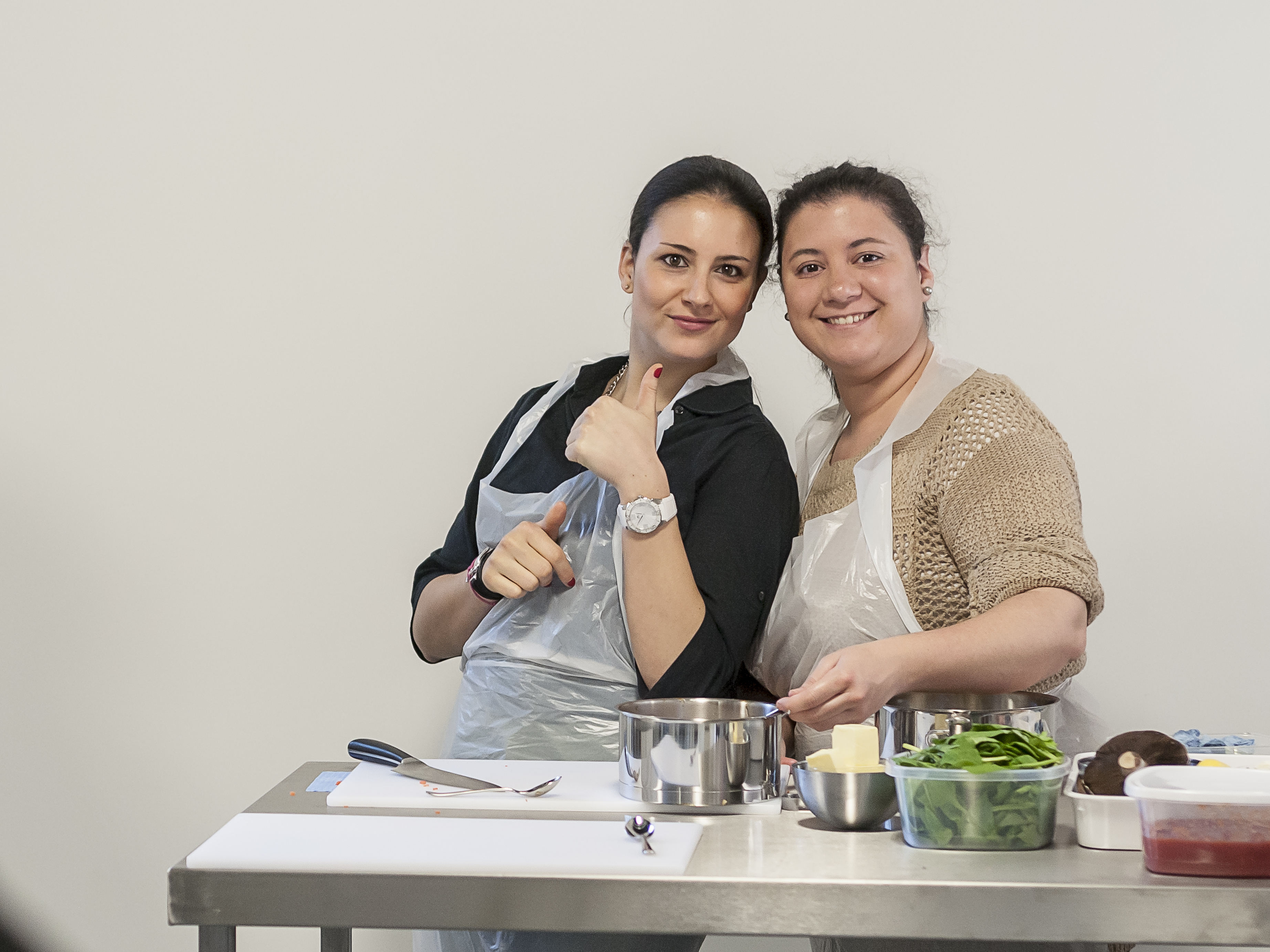 In-person cooking class at Jenius Social, featuring teamwork and skill-building.