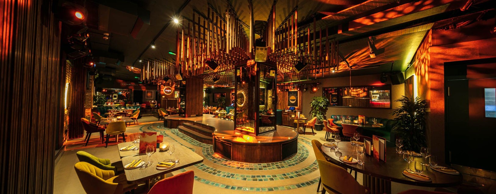 Vibrant LUNA LONDON restaurant with warm lighting, perfect for events and gatherings.