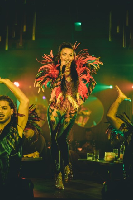 Dynamic singer in elaborate costume performing at LUNA LONDON event.