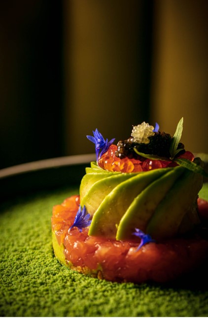 Elegant dish with vibrant garnishes at LUNA LONDON for high-end events.