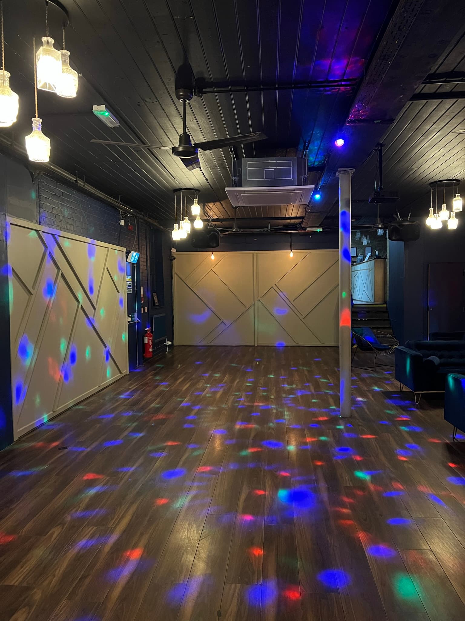 Industrial-chic event space with moody lighting for private parties and evening receptions.