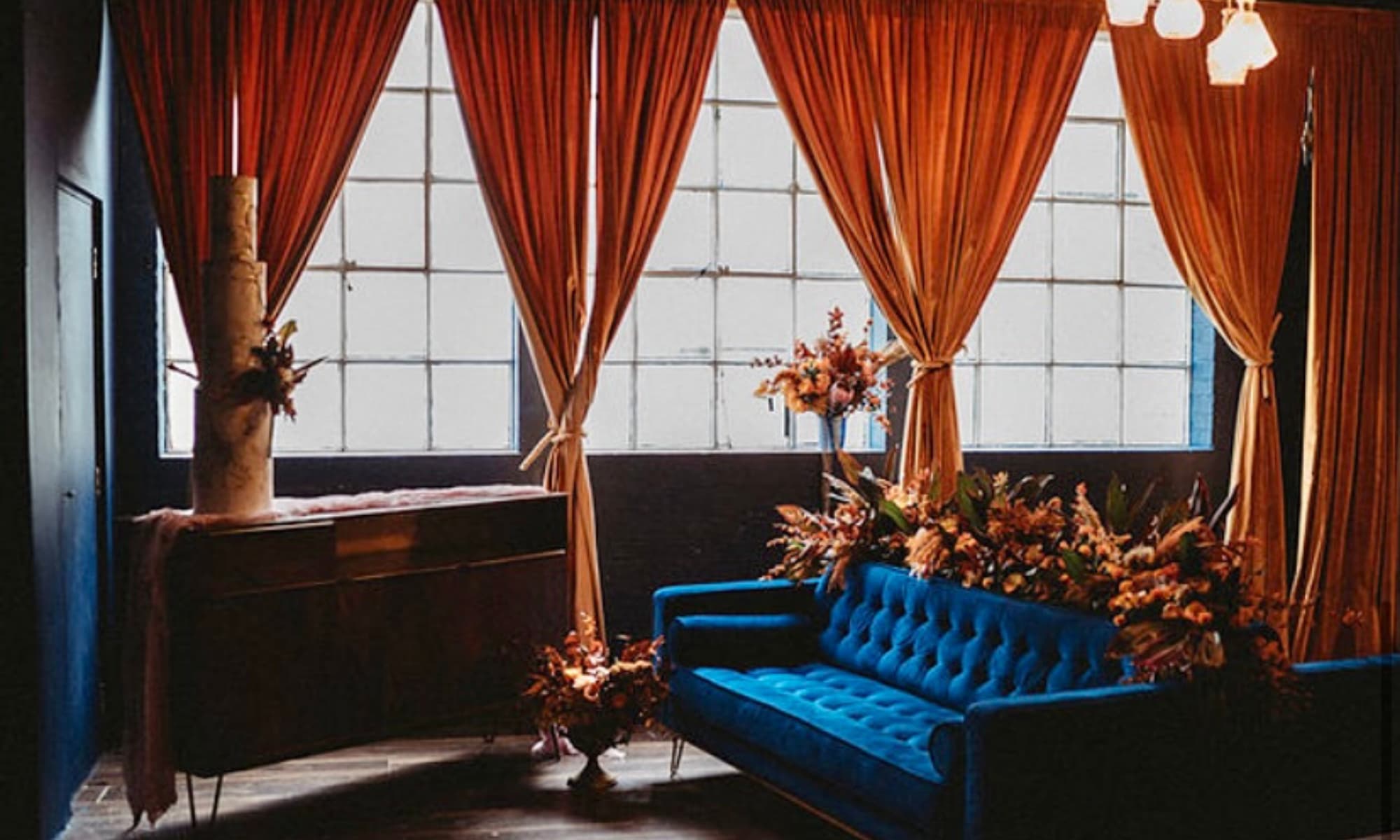 Navy and burnt orange lounge decor at The Venue on Middle St for upscale weddings and events.