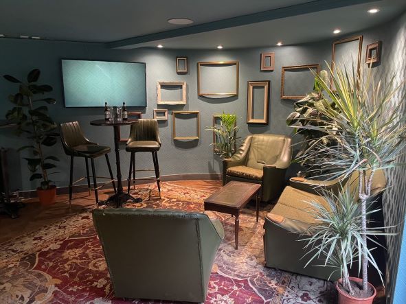 Cozy meeting space in The Clubroom, perfect for brainstorming and intimate gatherings.