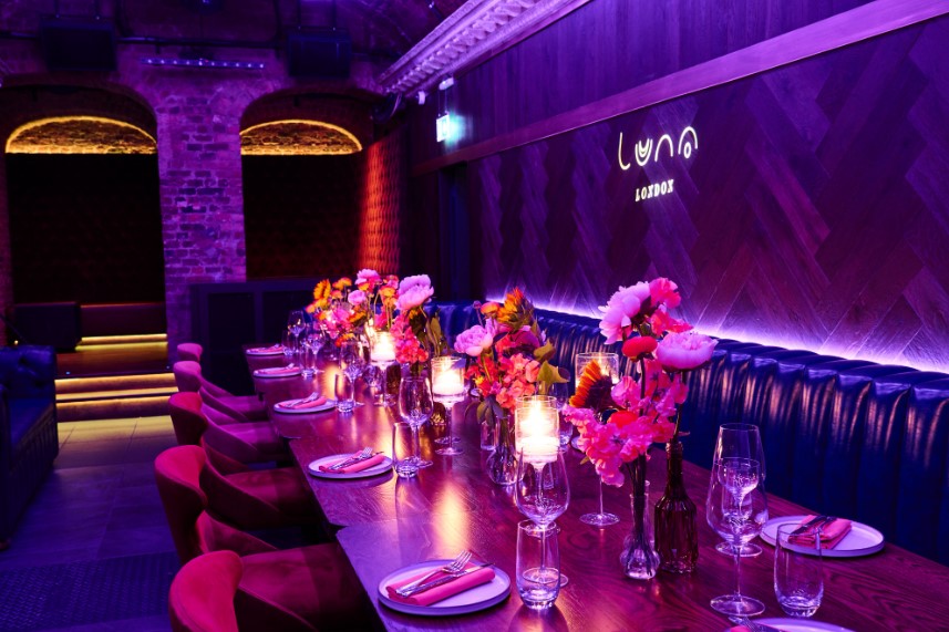 Elegant long table with flowers in Luna Lounge, ideal for upscale events and gatherings.